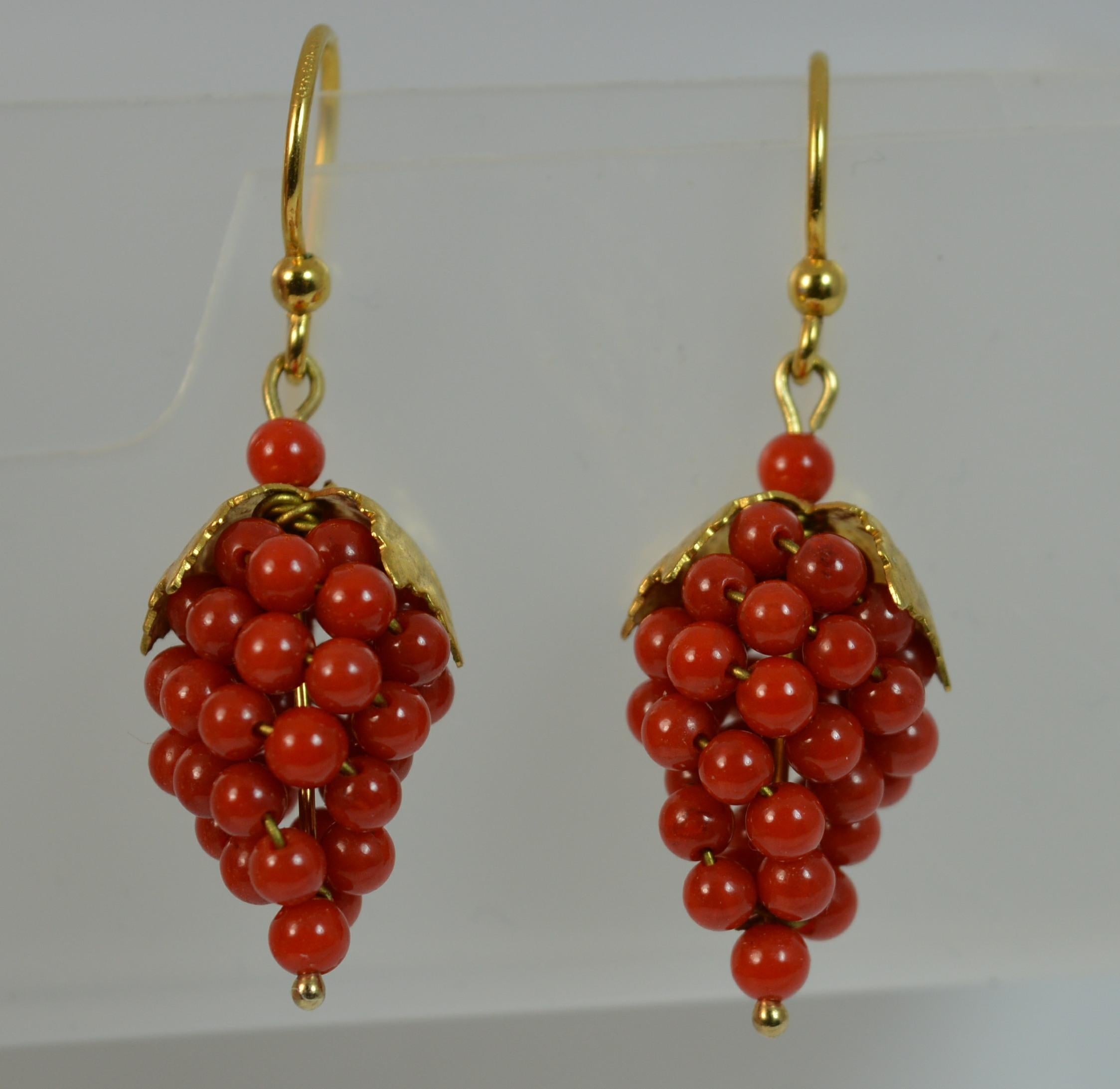 A stunning pair of drop dangle earrings.

True Victorian era example, c1880.

Modelled in 15 carat yellow gold.

Designed with two leaves to the top and coral cabochon stones shaped as berries below.

CONDITION ; Very good. Crisp design. In clean