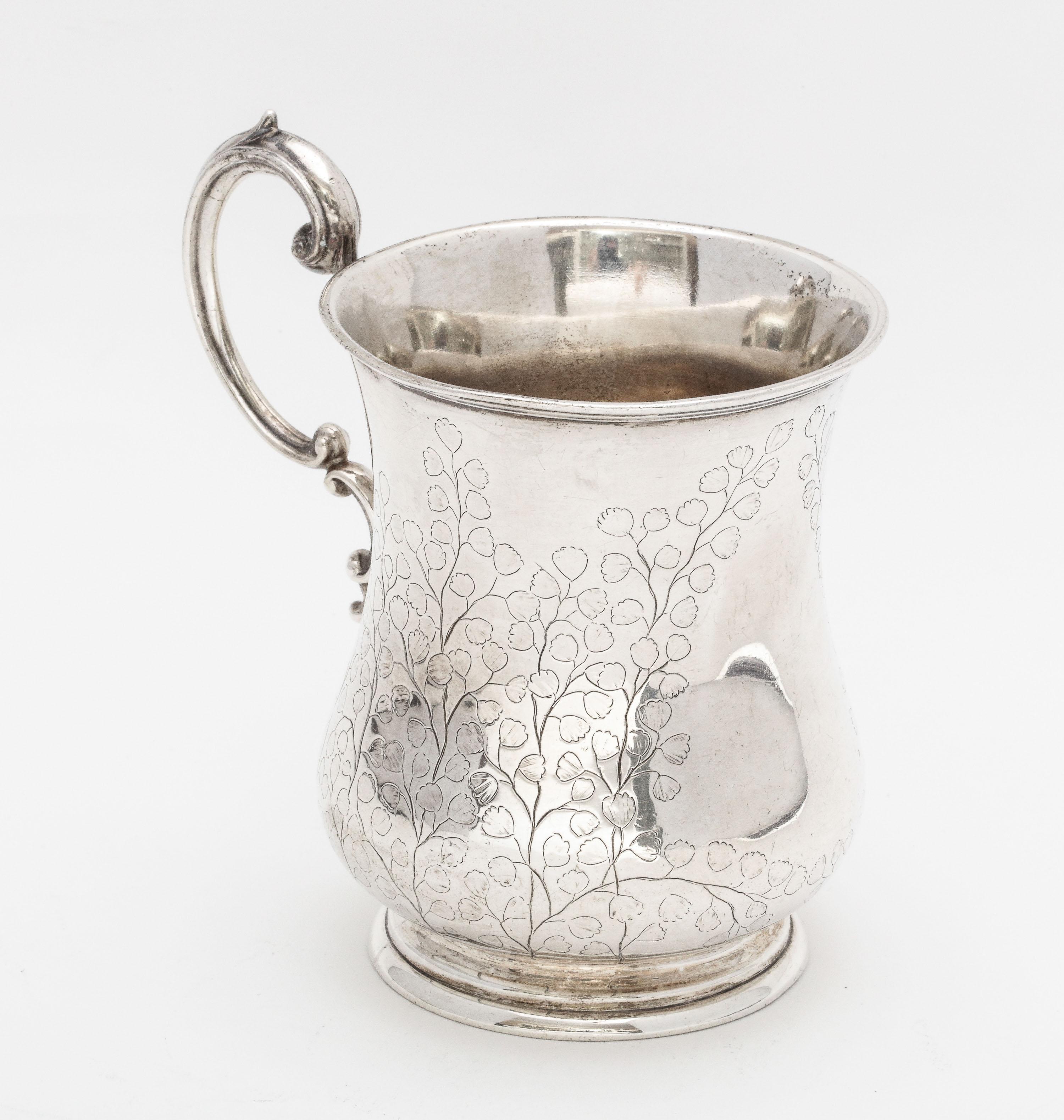 Victorian period, sterling silver, Anglo-Indian mug/cup, Calcutta, circa 1870s, Cooke and Kelvy - makers. Lovely etched designs. Measures 4 inches high (to top of handle) x 2 3/4 inches diameter x 4 1/4 inches from edge of handle far edge of cup