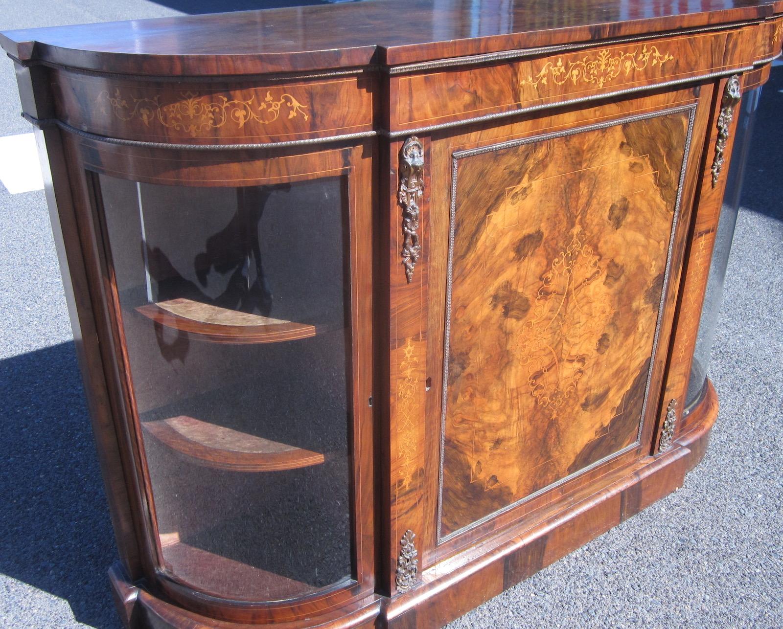 Victorian period top quality inlaid walnut credenza, 
circa 1870. 
Excellent color and patina, ormolu mounts. 
Original glazing. 151 x 40 x 104 cm high.
Our eclectic stock crosses cultures, continents, styles and famous names.