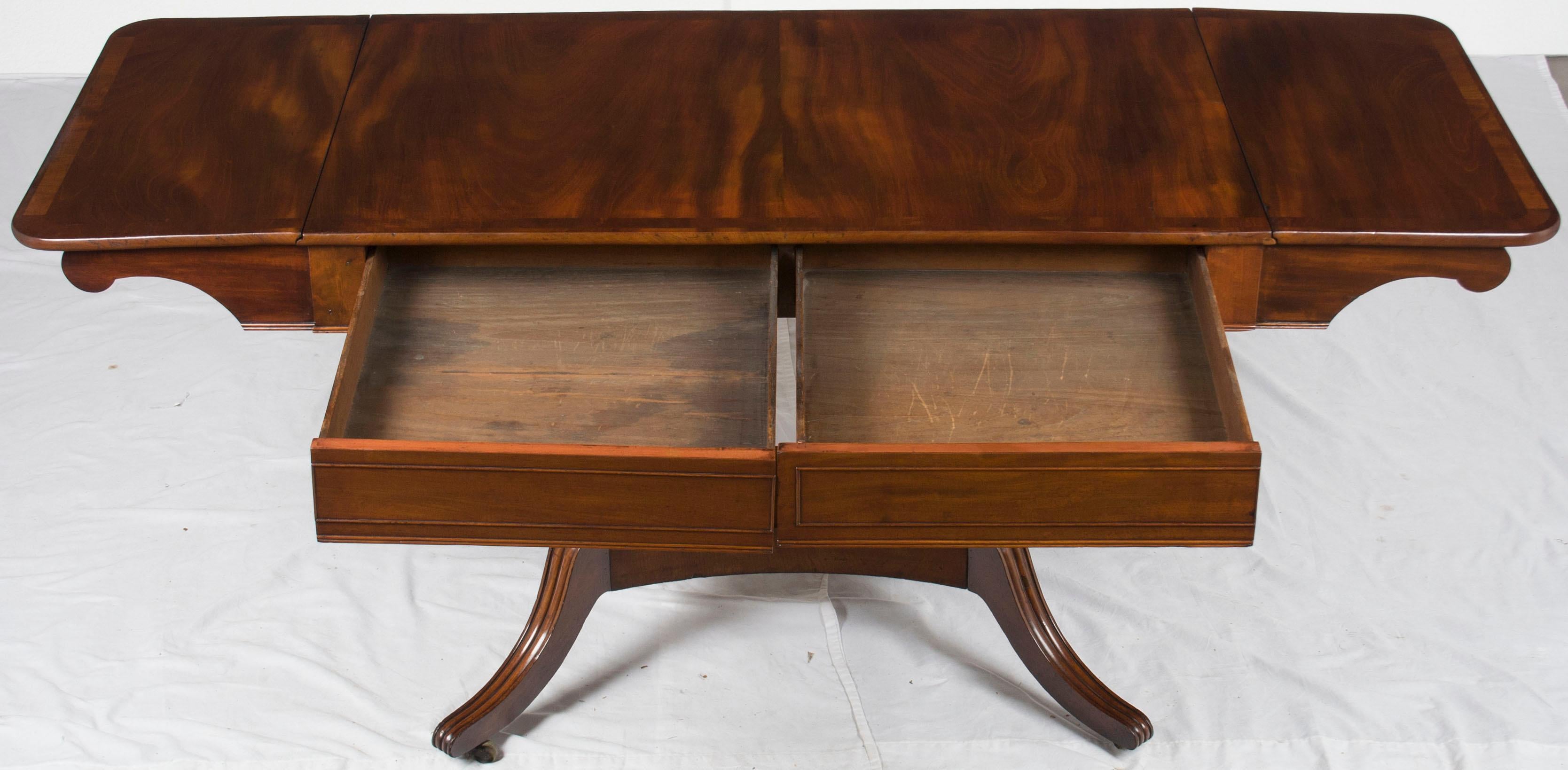 You can use this gorgeous piece as either a small drop-leaf desk or a stunning sofa table. It’s great size, beautiful design, and unique wood all really lend themselves to today’s styles.

The most distinguishing feature of this sofa table is the