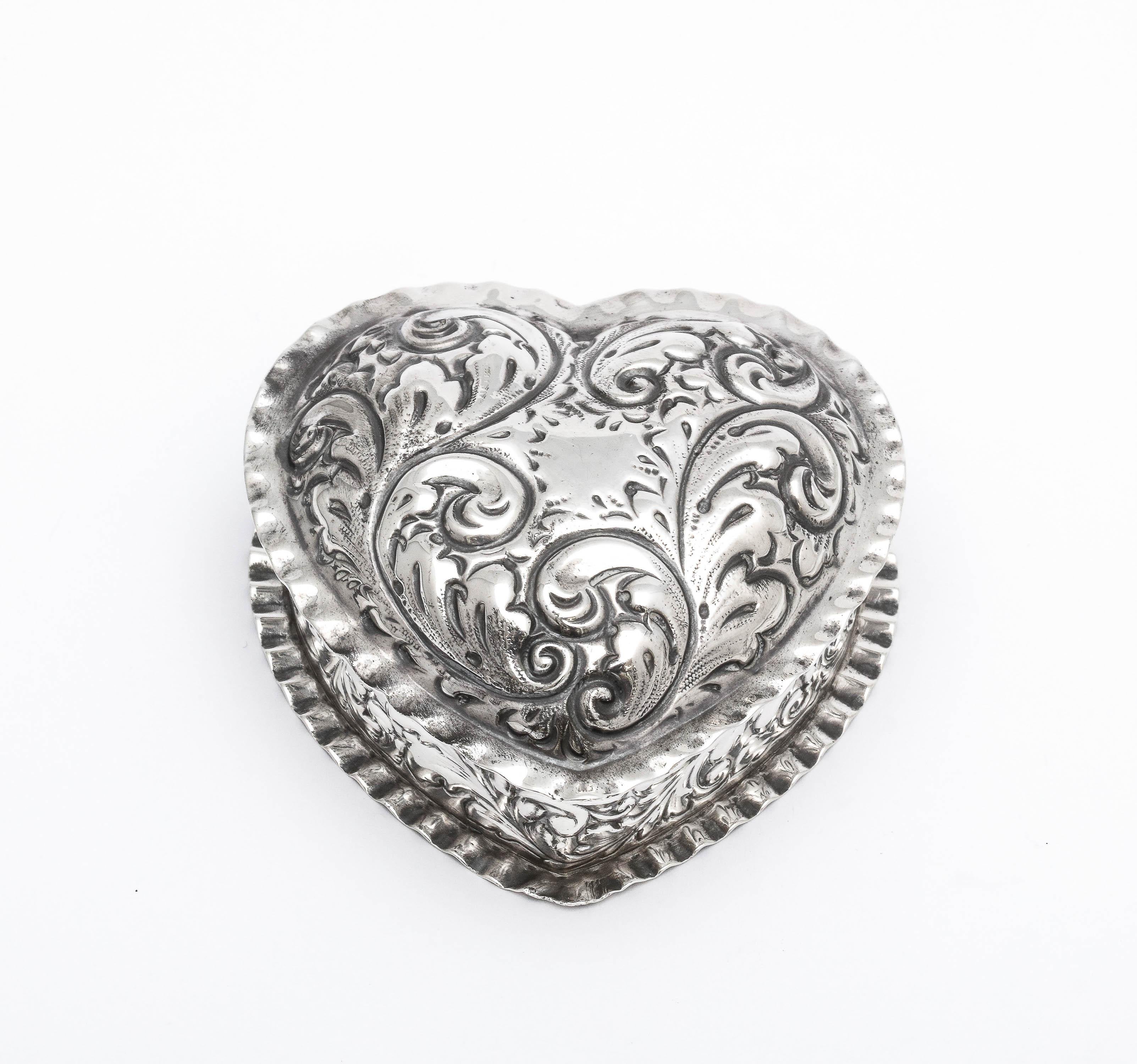 Victorian Period, sterling silver heart-form trinkets box, Gorham Manufacturing Company, Providence, Rhode Island, year-hallmarked for 1893. Measures 3 inches wide (at widest point) x 3 inches deep (at deepest point) x 1 1/4 inches high (at highest