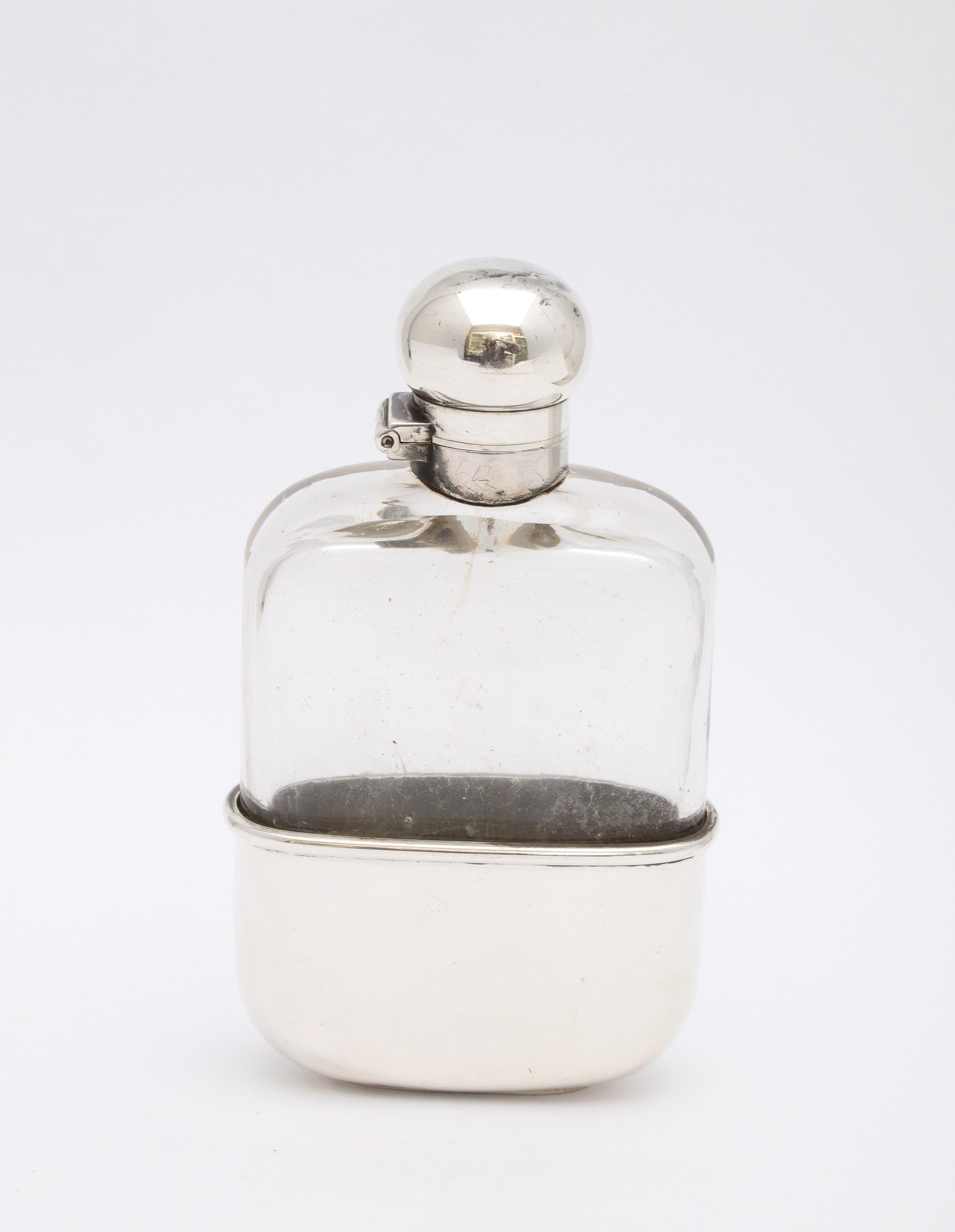 Victorian period, sterling silver-mounted glass liquor flask with hinged lid and removable drinking cup, Chester England, year-hallmarked for 1898, Cohen and Solomon - makers. Sterling silver bottom of flask (the inside of which is lightly gilded)