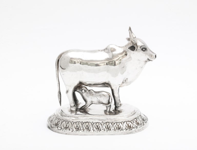 Victorian period, sterling silver (unmarked, but tested) statue of a cow and her calf, India, Ca. 1900. Measures 4 1/2 inches wide (at widest point) x 4 1/2 inches high (at highest point) x 2 1/8 inches deep (at deepest point). Weighs 7.445 troy
