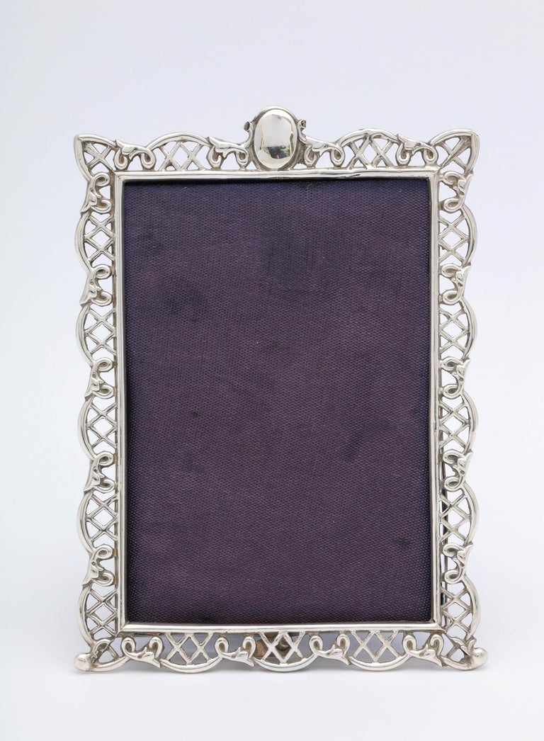 Victorian Period, sterling silver wire picture frame with blue velvet back, Birmingham, England, year-hallmarked for 1896, Deakin and Francis - makers. Measures 4 3/4 inches high (at highest point) x almost 3 1/2 inches wide (at widest point) x 3