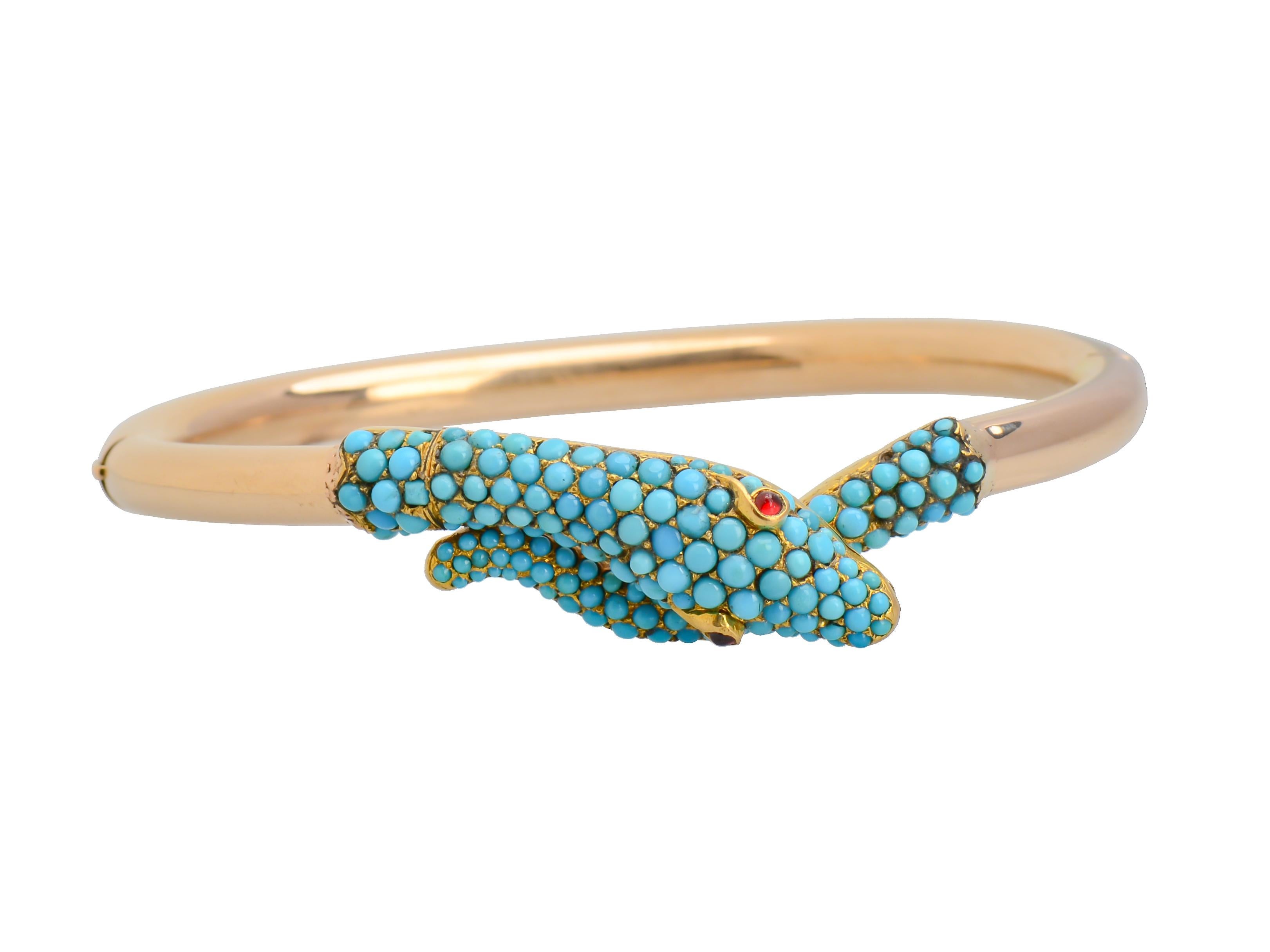 An astonishing serpent bracelet in 14 Kt gold, abundant in close set Persian turquoise finely hand crafted in Austria Hungary c. 1860. The bracelet is a rare beauty and surpasses the quality of most offered for sale today. I believe photographs