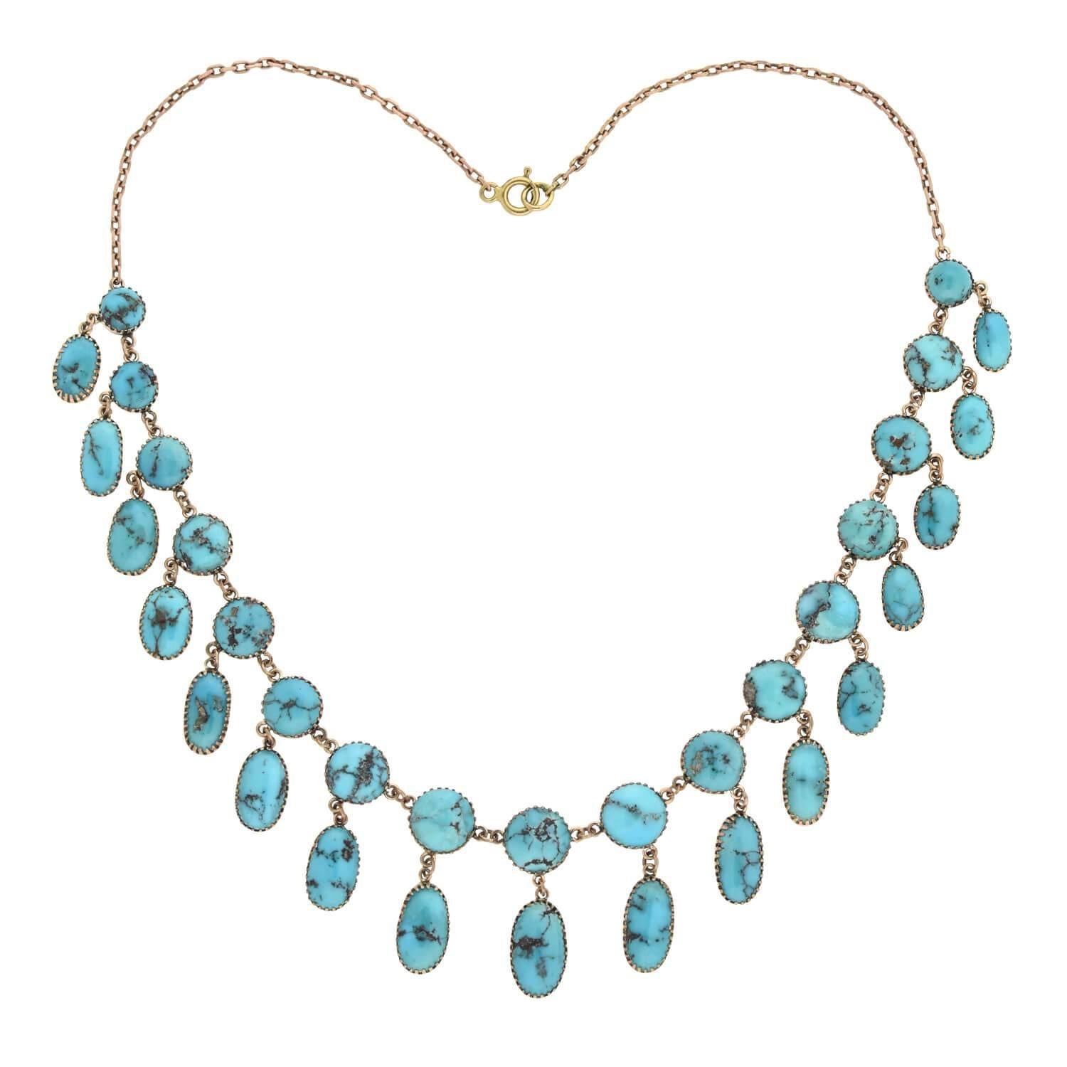 A stunning turquoise necklace from the Victorian (ca1880s) era! This lovely piece is set in 14kt rose gold and is comprised of 17 round cabochon and 17 oval-shaped turquoise stones. Each of the oval shaped stones dangle from the round turquoise