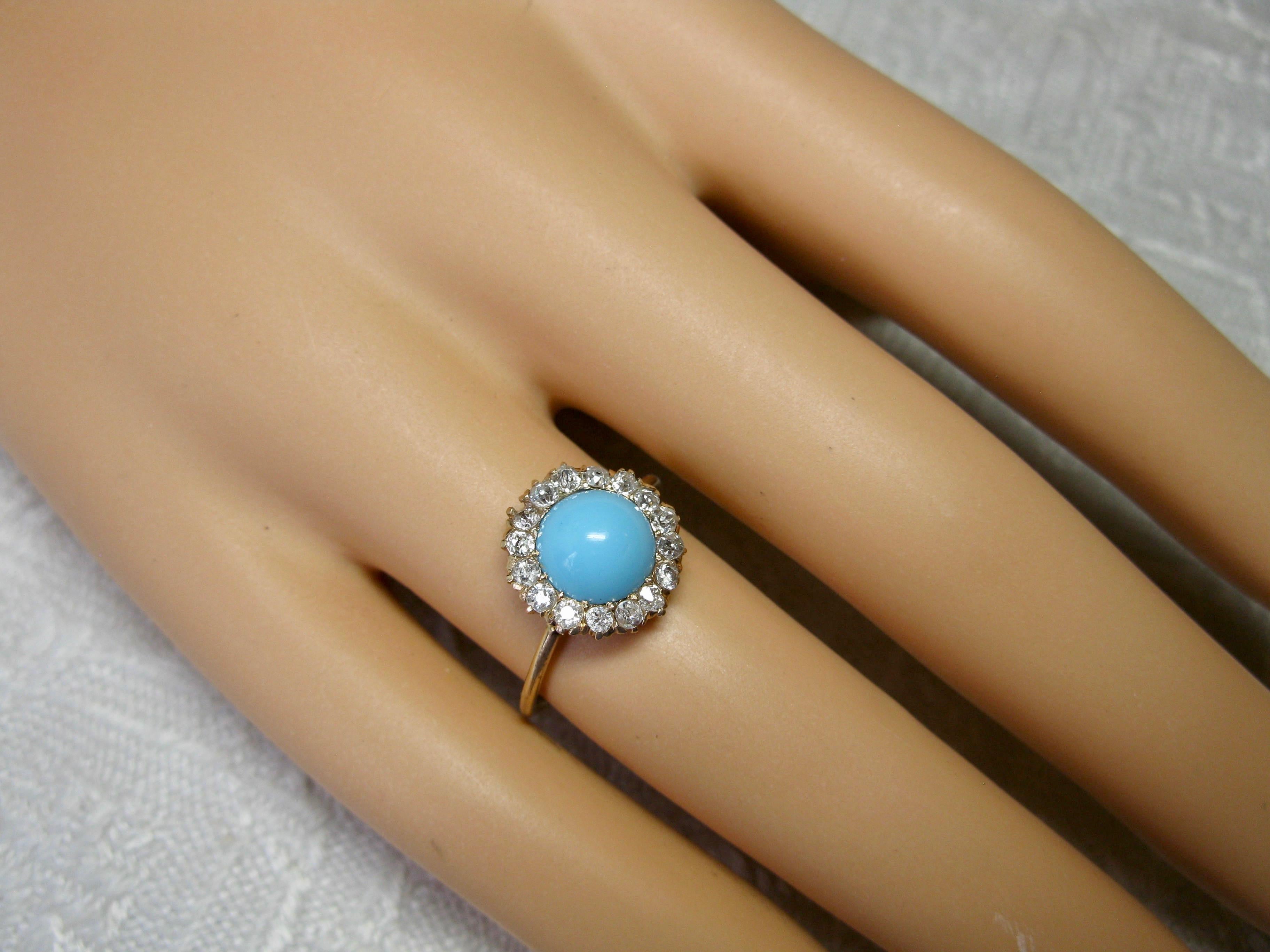 An Antique Victorian - Edwardian Ring with a gorgeous natural Persian Turquoise cabochon of stunning beauty. The Turquoise is surrounded by a halo of 16 sparkling antique Old Mine Cut Diamonds. This is the combination everyone dreams of!  The jewels