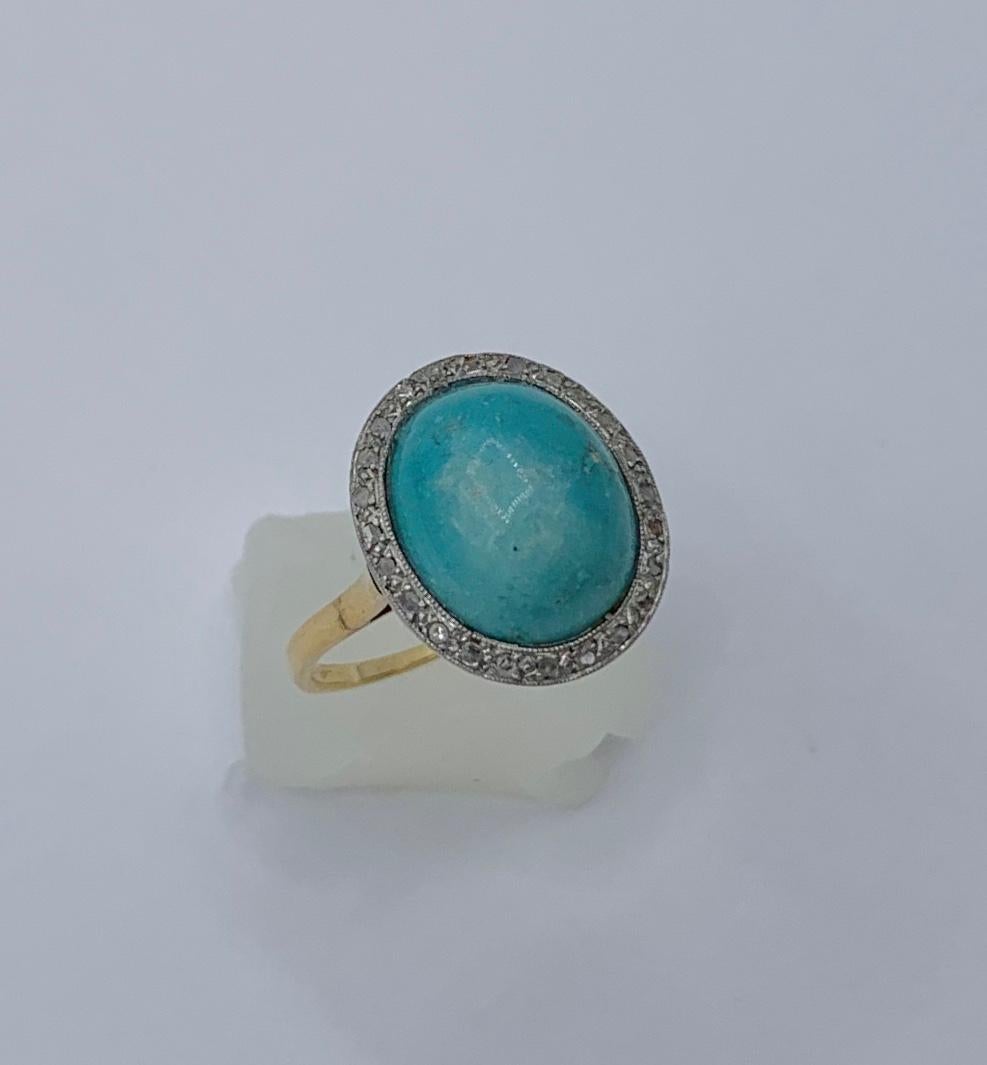 This is a magnificent Antique Victorian - Art Deco Ring with a gorgeous natural Persian Turquoise cabochon of stunning beauty surrounded by a halo of 24 sparkling antique Rose Cut Diamonds in 18 Karat Gold.   The Persian Turquoise is a beautiful
