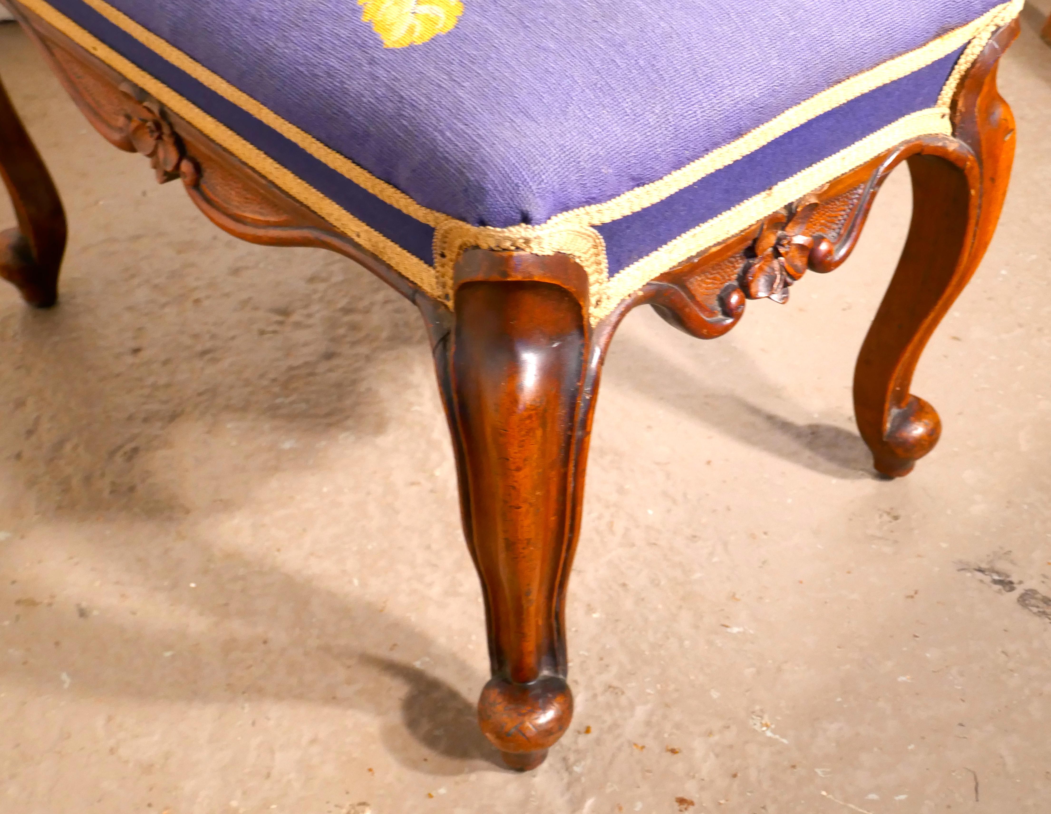 Victorian petit point tapestry upholstered mahogany stool

A lovely piece, this Victorian stool is made in Mahogany, it stands on decorative carved Cabriole legs and has a floral embroidered seat on a blue background
The seat is original 19th