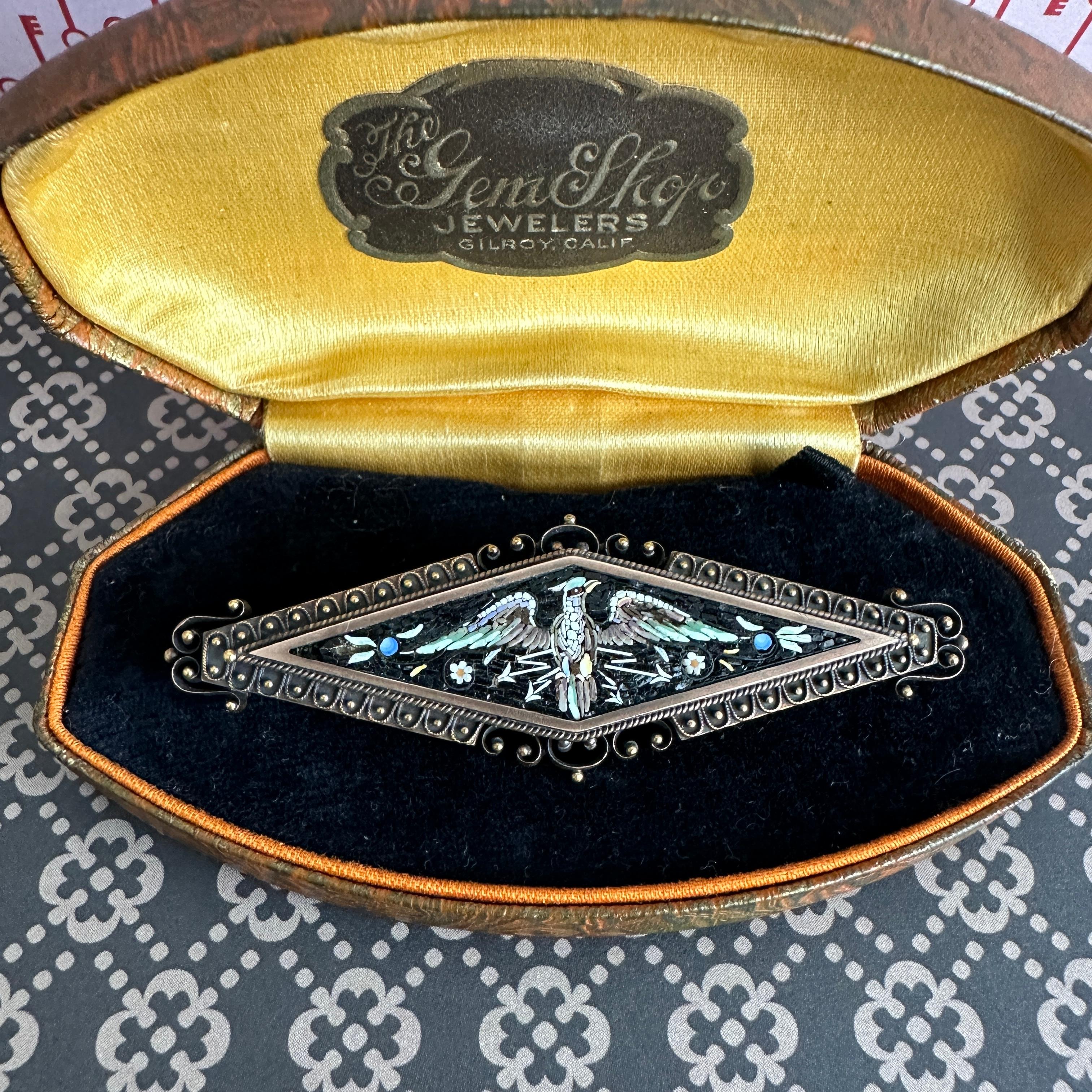 Details:
Really cool antique Italian micro mosaic brooch with a Greek mythological phoenix bird. The phoenix rises out of her ashes stronger and more powerful than she was before! This micro mosaic brooch from the Victorian Era depicts a large bird