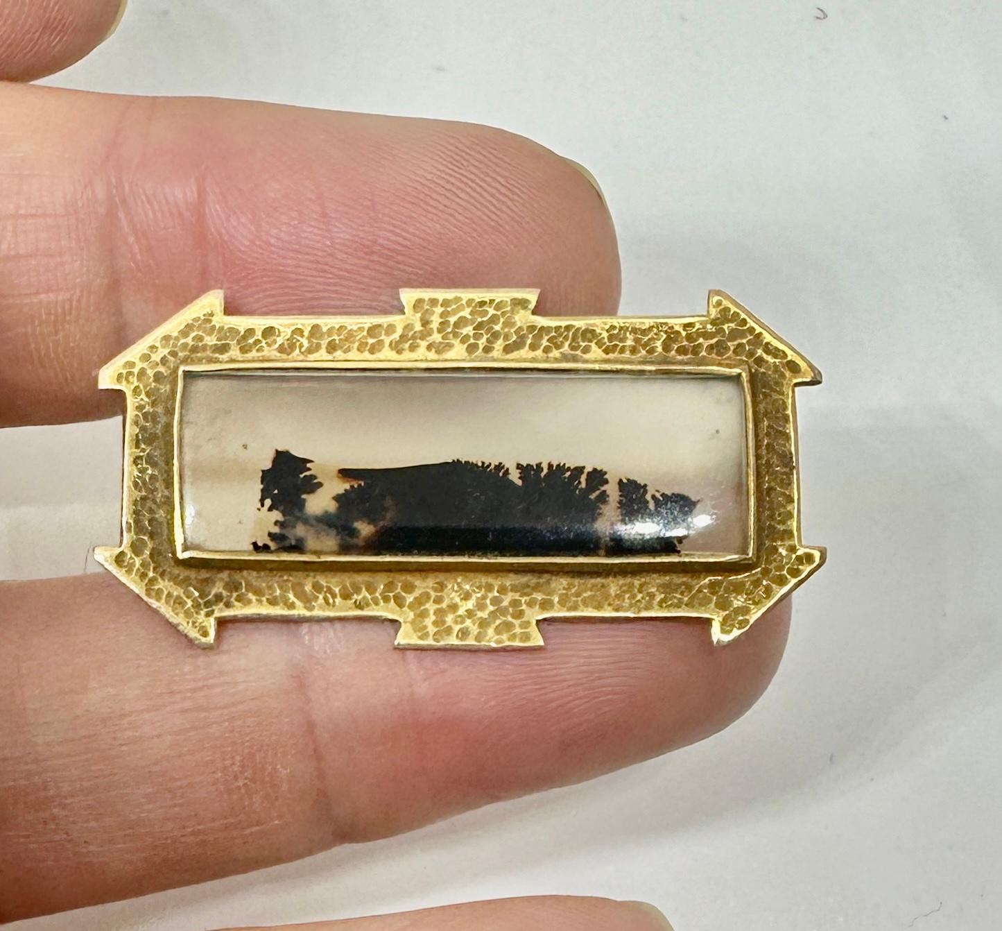 This is an absolutely stunning antique Victorian Picture Agate Brooch Pin set in a gorgeous Etruscan Revival setting in 10 Karat Gold.  The Picture Agate depicts a forest scene and is a fabulous example of nature's wonder.  The natural picture agate