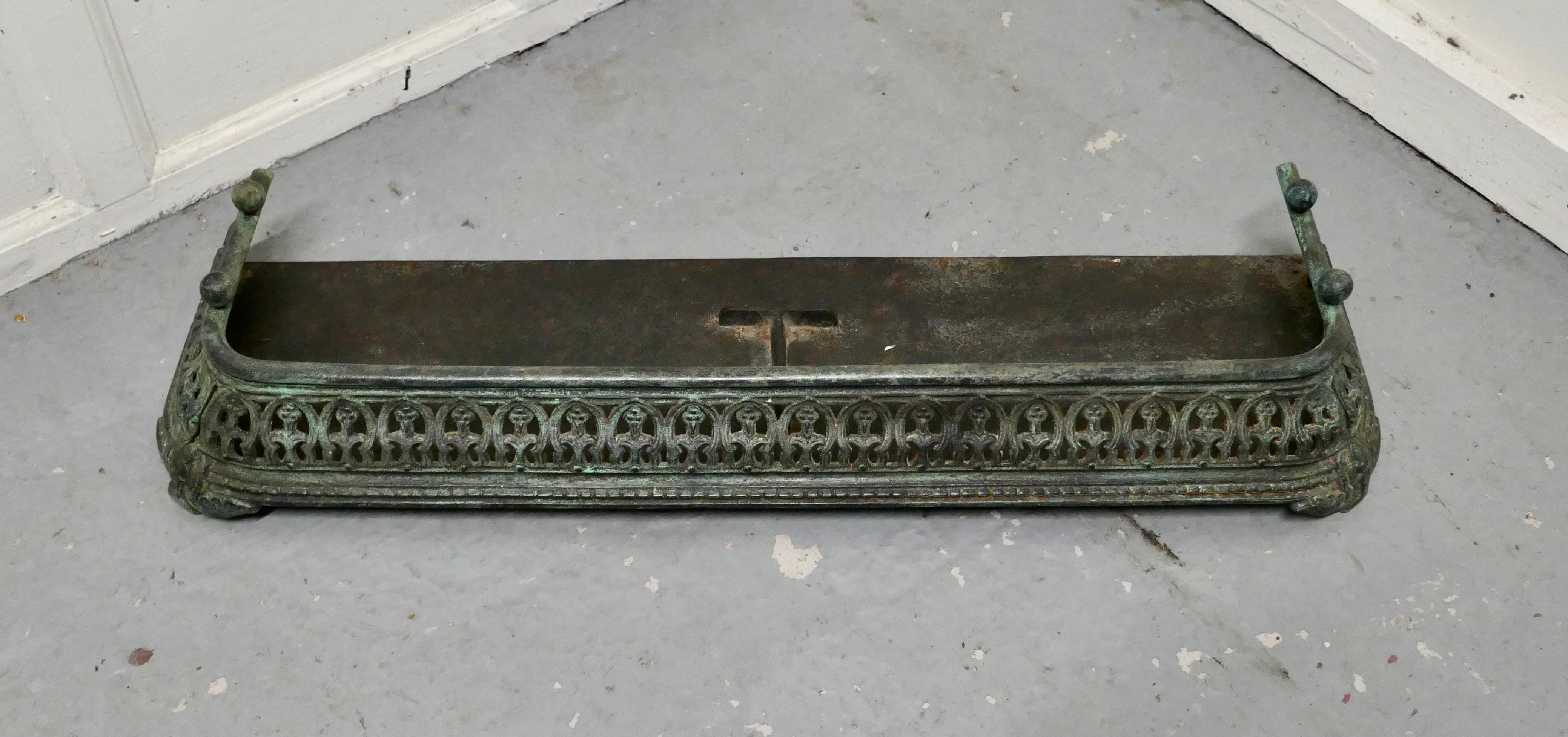 Victorian Pierced cast iron fender

This is a beautifully designed Victorian fender it is heavy quality 
The fender is in good sound condition and has slightly verdigris finish, it is 6” high, 37” long and 12” deep 
TGB735.