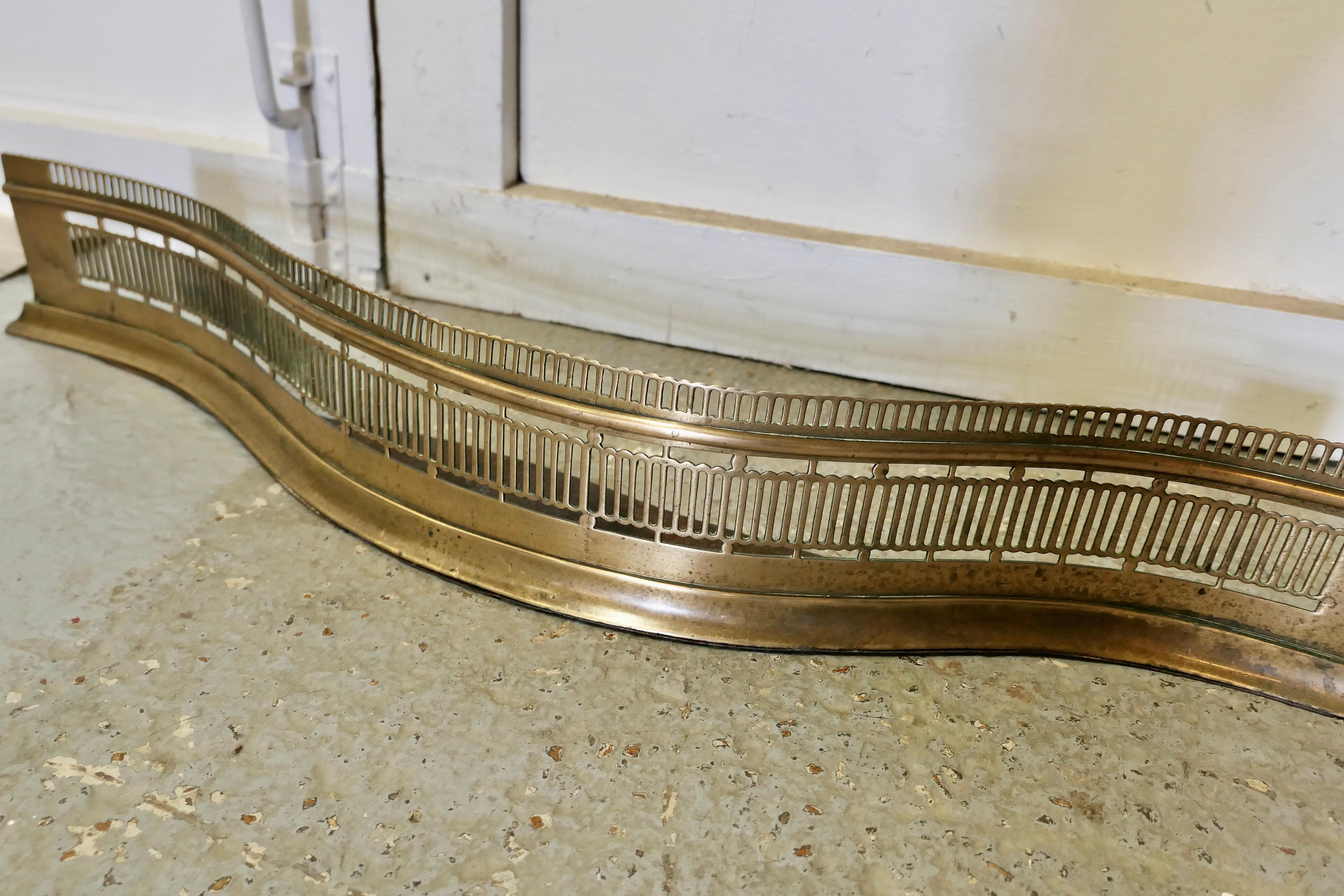 19th Century Victorian Pierced Serpentine Shaped Brass Fender     For Sale