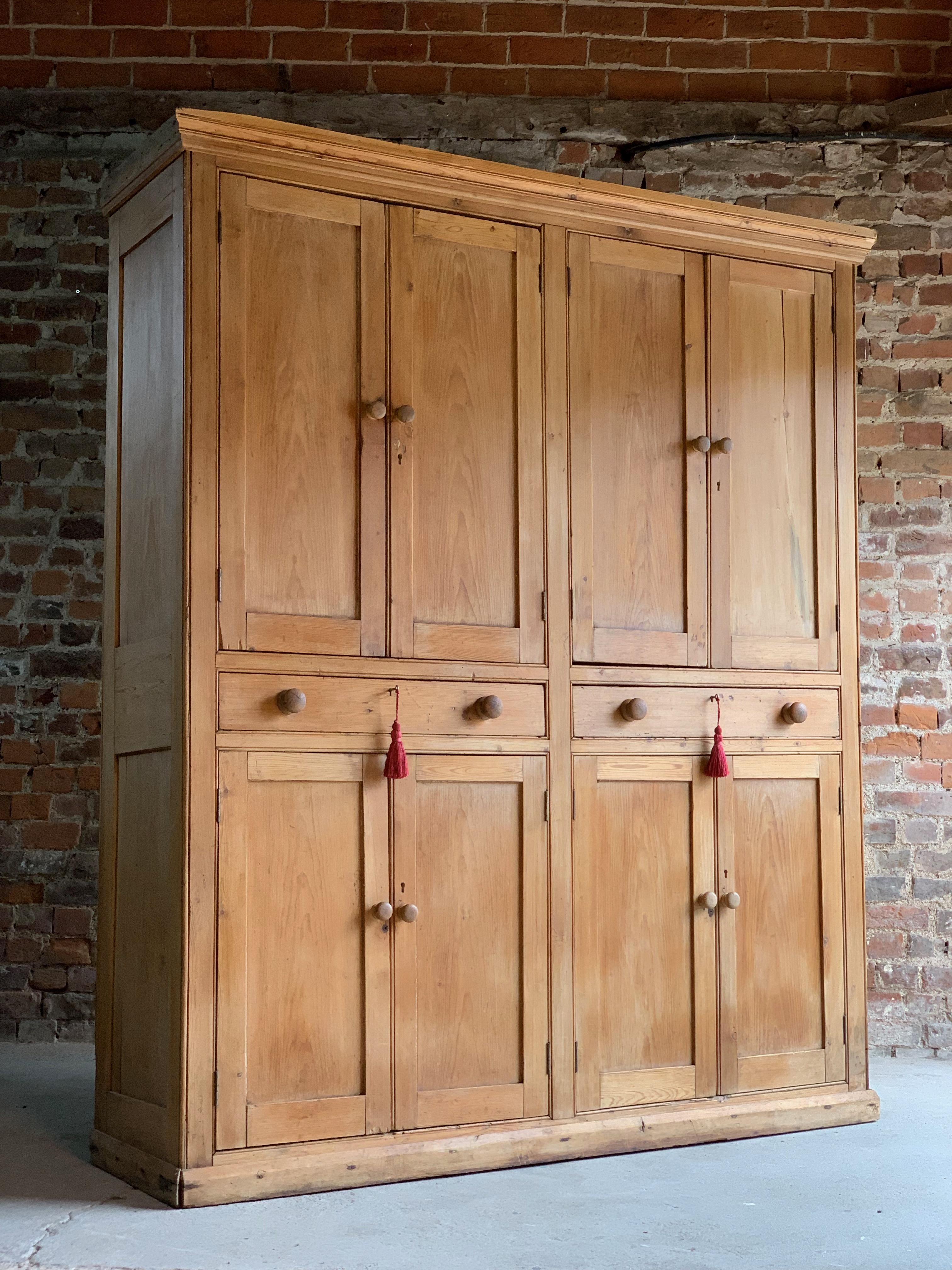 Victorian pine housekeepers cupboard pantry antique 19th century circa 1890

A magnificent large and imposing antique Victorian pine housekeepers cupboard circa 1890, The top section with cornice over four panelled cupboard doors with knob handles,