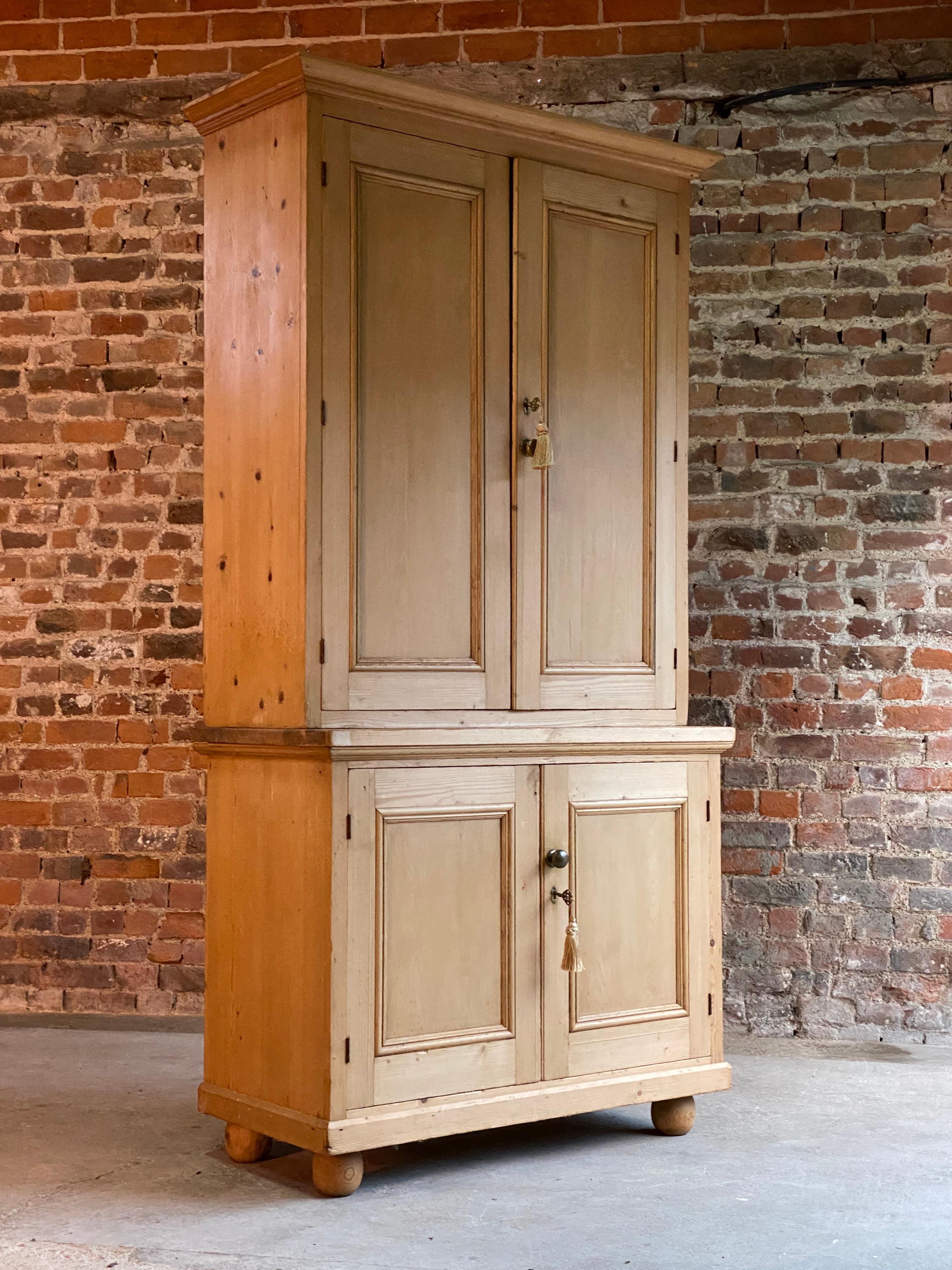 Victorian pine housekeepers cupboard pantry antique, 19th century, circa 1890

A magnificent Victorian pine housekeepers cupboard circa 1890, The top section with cornice over two paneled cupboard doors with brass knob handle, three full length