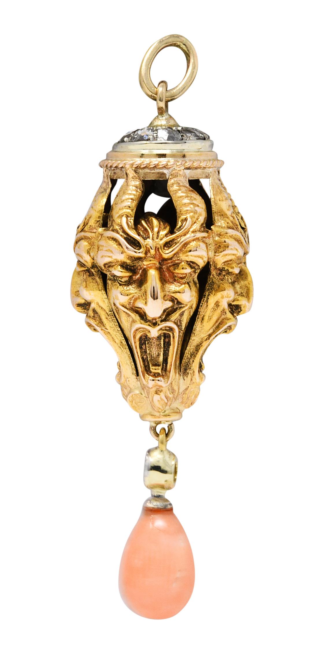 Pendant charm features a repeated devil motif as a pendulum form

Faces are horned and highly rendered and suspend an articulated coral drop

Opaque and pastel orangey pink in color with subtle mottling

With a round brilliant cut diamond weighing