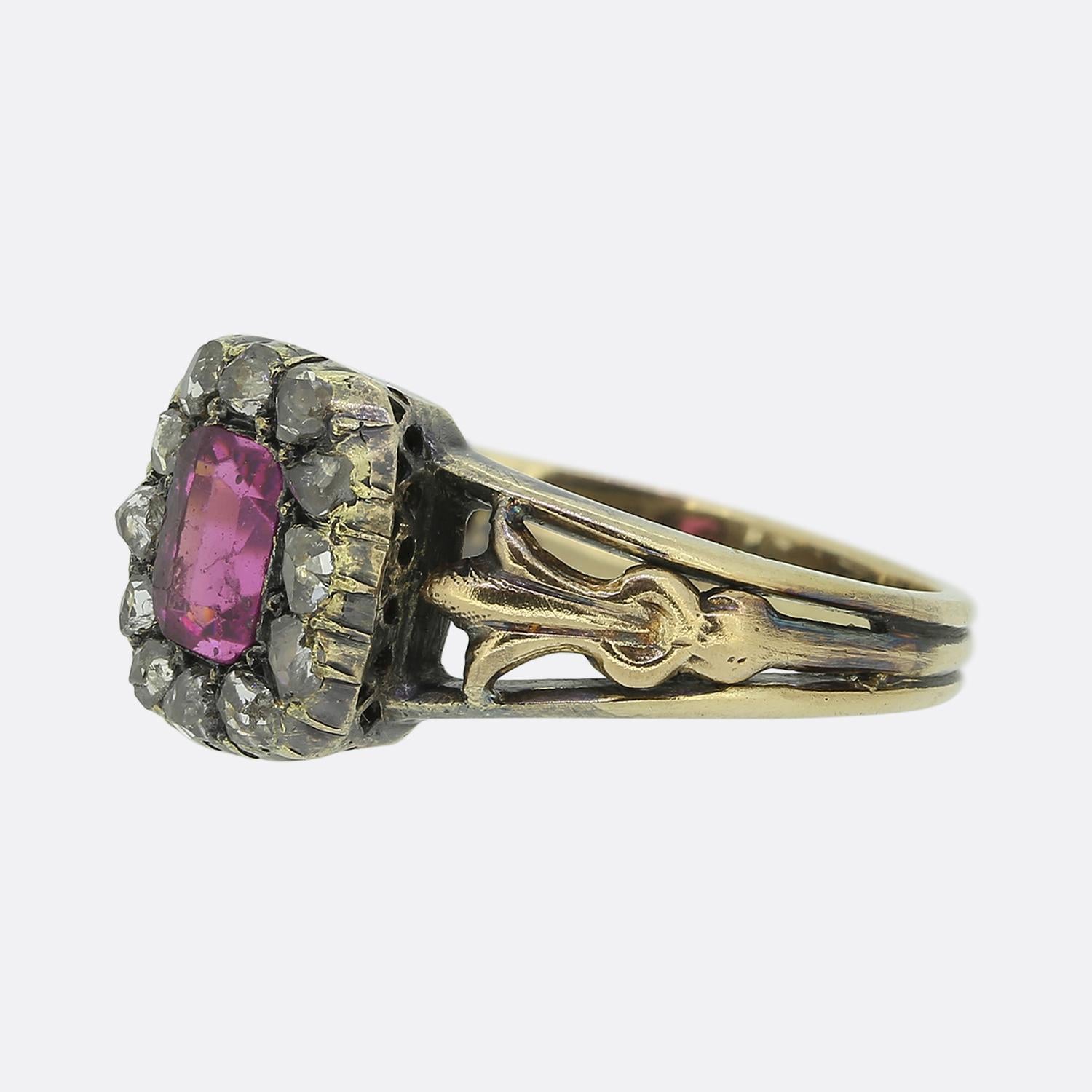 Here we have a lovely antique cluster ring. A single emerald shaped pink paste sits at the centre of the face and is contained within a frame of rose cut diamonds around the outer edge. The piece is accentuated through excellently open crafted