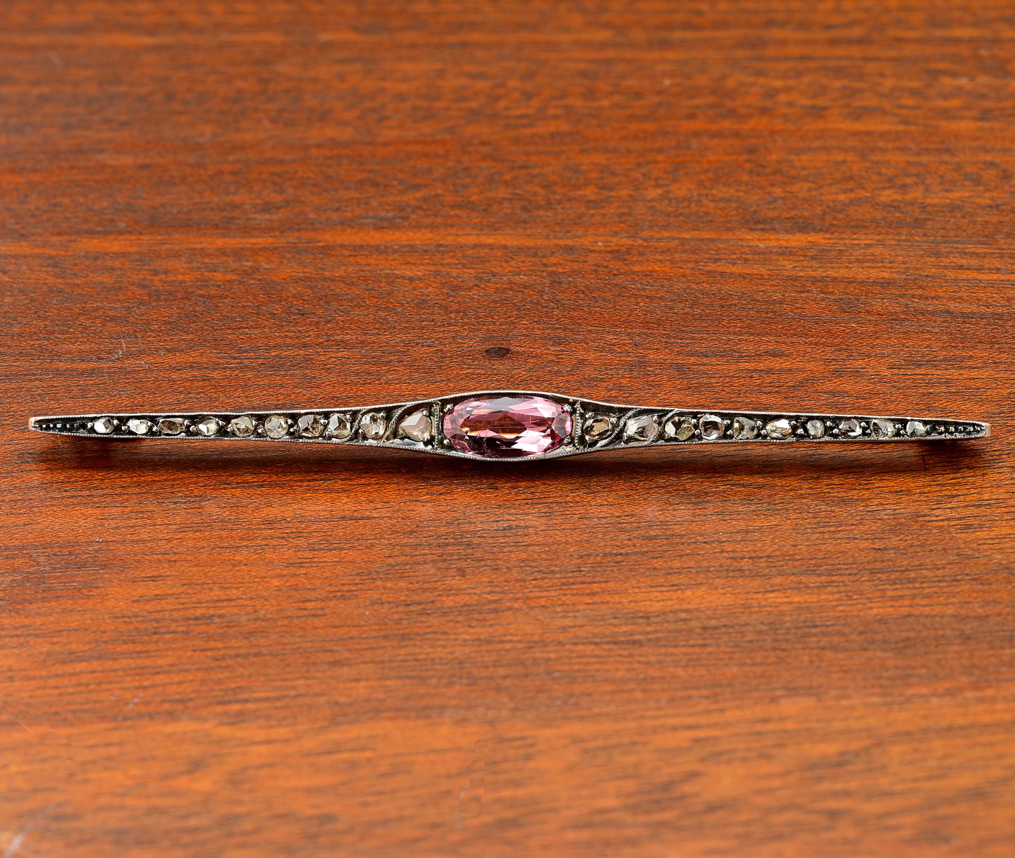 This gorgeous antique bar brooch is Victorian period, 1900 circa
Exquisitely hand crafted of solid 18 Kt gold silver topped
Essential bar design timeless and ever elegant
Centrally set with a untreated natural Pink Topaz estimated 2.15 Ct (11.90 mm.