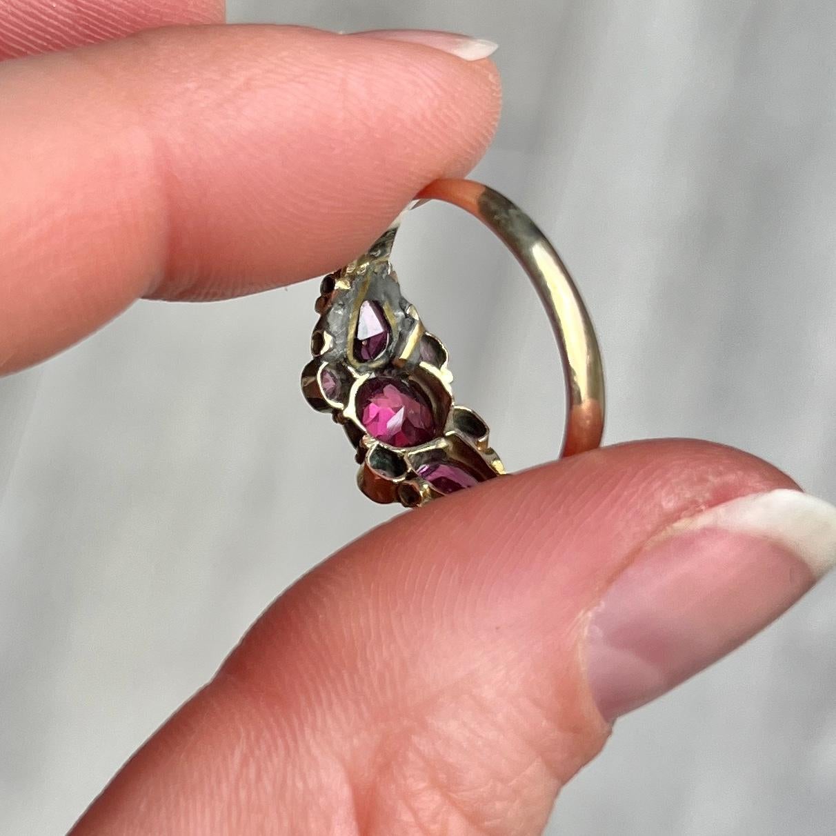 This stunner holds seven deep pink tourmaline that are beautifully cut and catch the light just right to get that sparkle. They are set almost flush within the decorative 12ct gold band. Hallmarked Birmingham 1873.
*please note there are signs of an