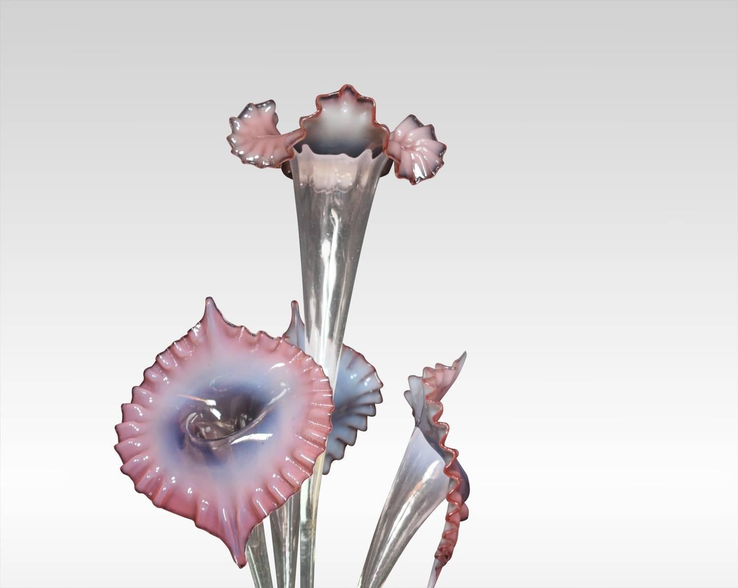 Mid-19th century English Victorian pink Vaseline glass Epergne, comprising of four flutes, rising from a scallop edged round tray.
Dimensions:
Height 21.5 inches
Width 12 inches
Depth 12 inches.