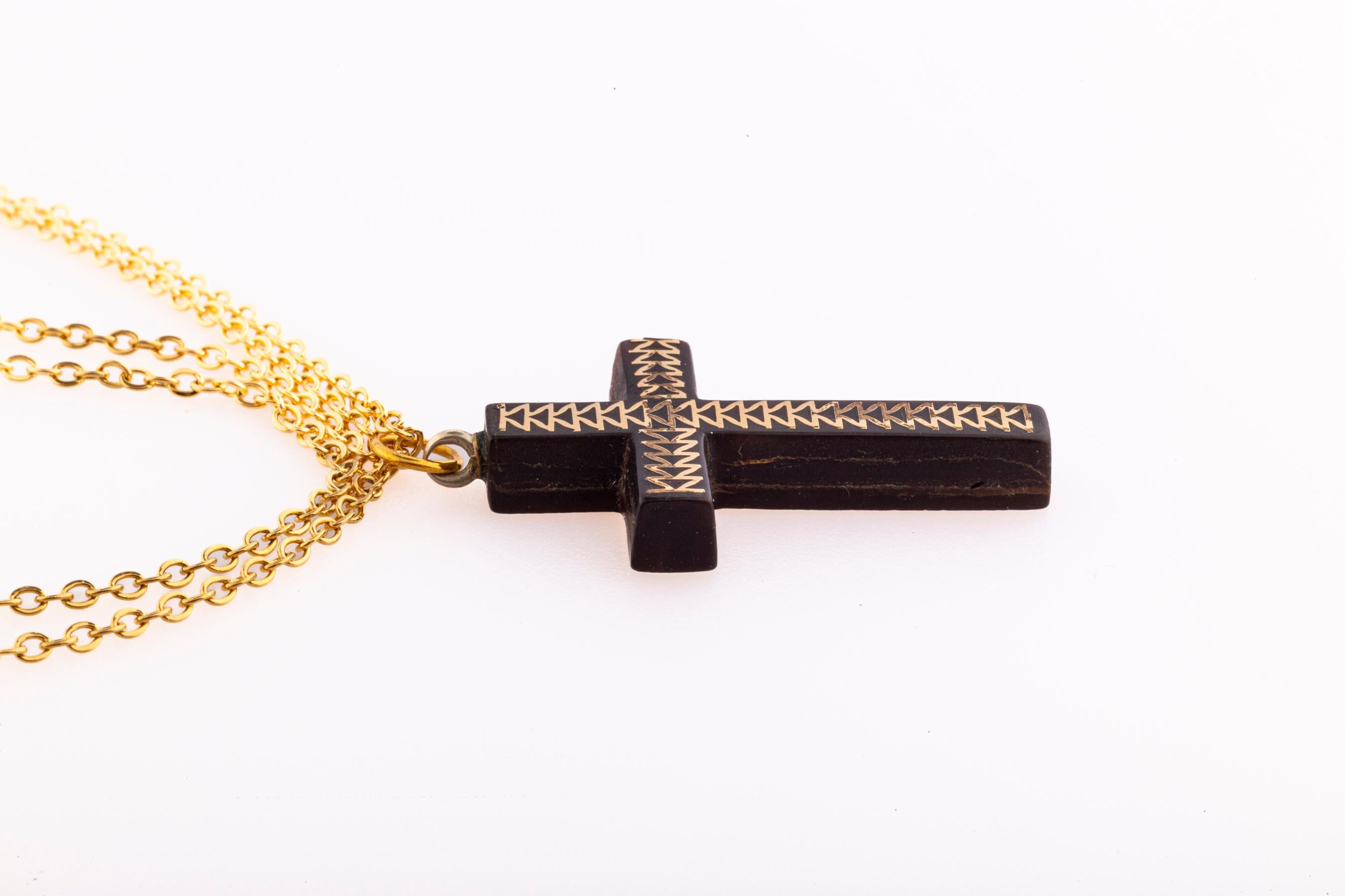 The pique cross is an easily wearable size. It was made c. 1860-70 in England. The condition is perfect. A lovely usable religious symbol or for cross collectors. Size 1 3/8 in long 5/8 inch wide. Weight 1.2 gram