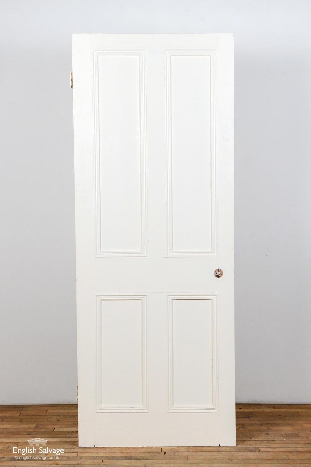 Reclaimed Victorian door with four panels made from pitch pine. The door has beading detail to one side. Handle and nail holes and two hinges present.