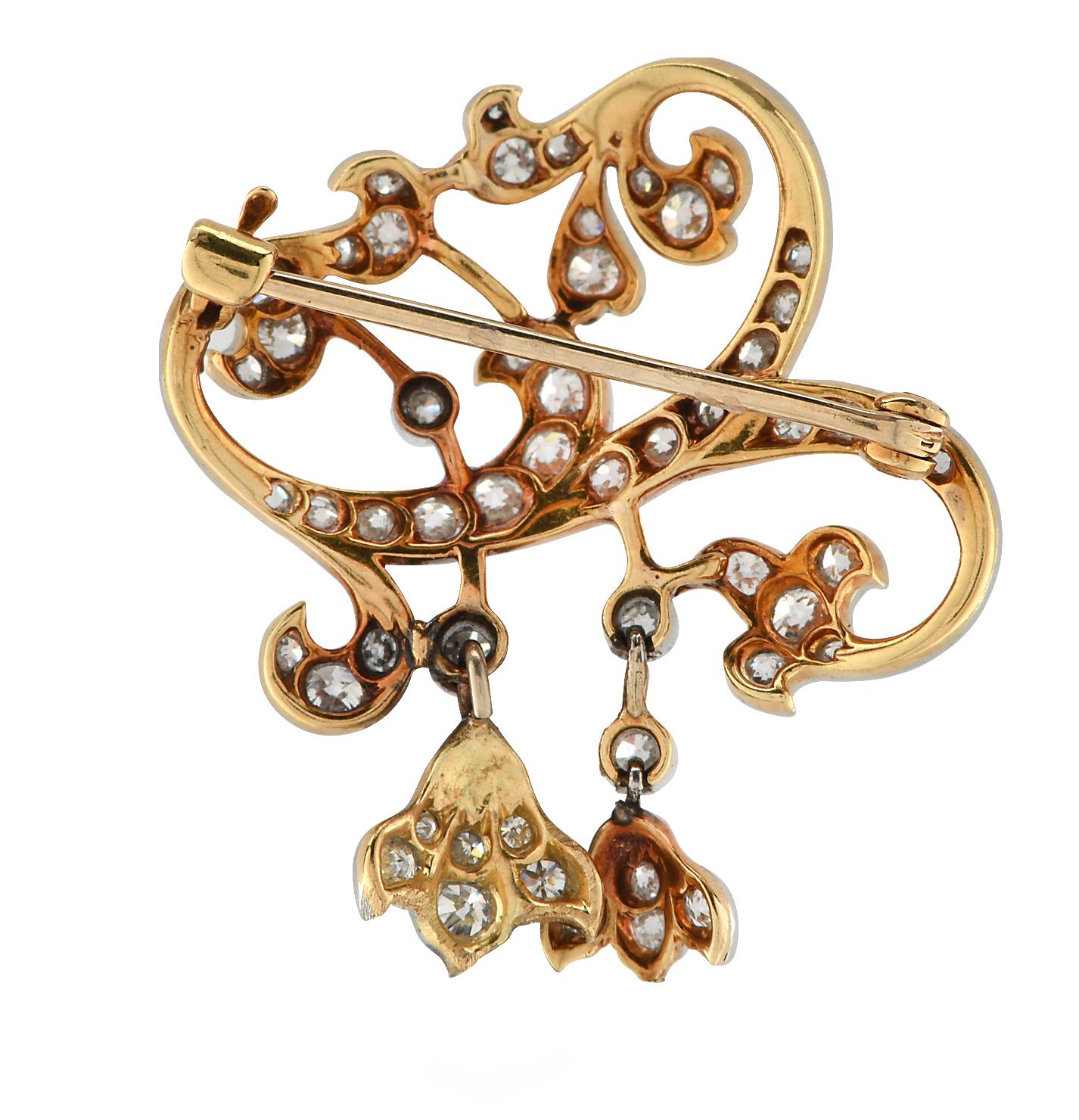 Gorgeous Victorian Brooch Pin crafted in 22 karat yellow gold and platinum, featuring 42 Old European Cut diamonds weighing approximately 1.05 carats total, G color, VS-SI clarity set in a beautiful floral design. This ornate brooch pin measures 30