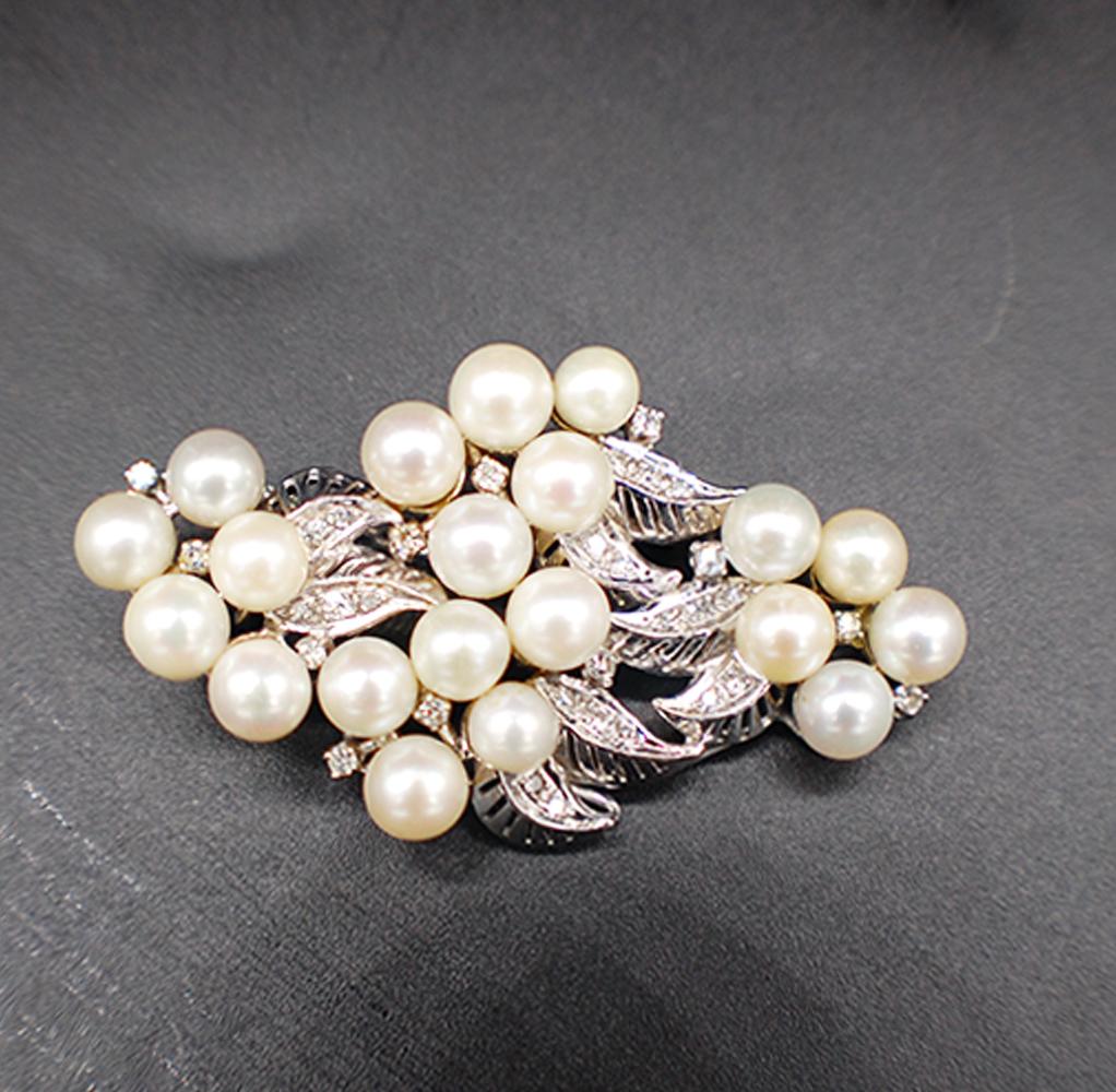 Victorian Platinum Pearl Pin Circa 1890
Quality pearls are matched and 20 items ranging from 5.60-6.06 mm each. The pearls have a high luster with color of cream to grayish-cream. Blemish free quality of AA.

Diamonds are sprinkled on the leaves of