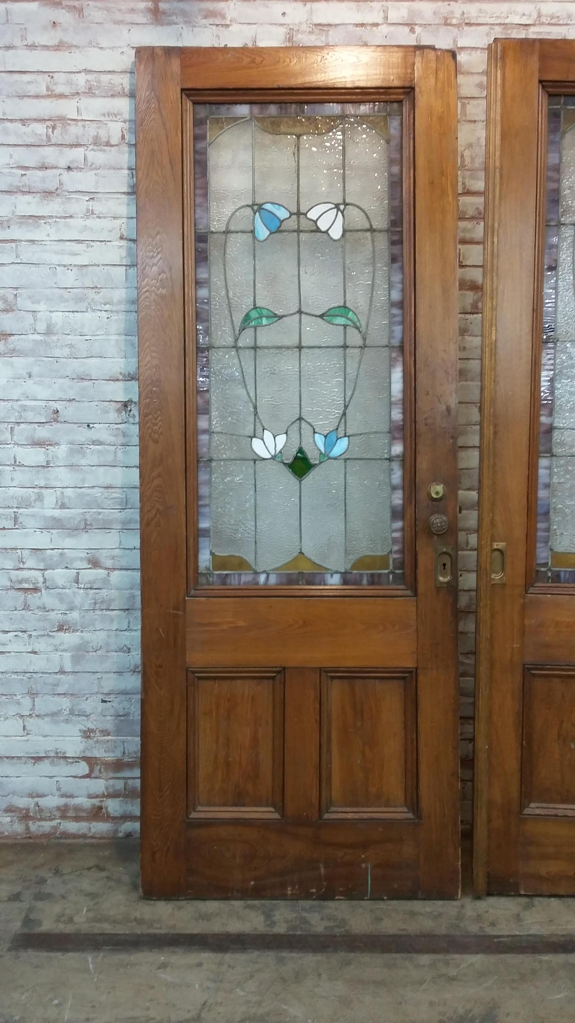 Victorian pocket doors with stained glass panels
Original bronze knobs
Very good condition with only one crack visible on right door
Doors may have been converted from pocket doors
Each door is 96
