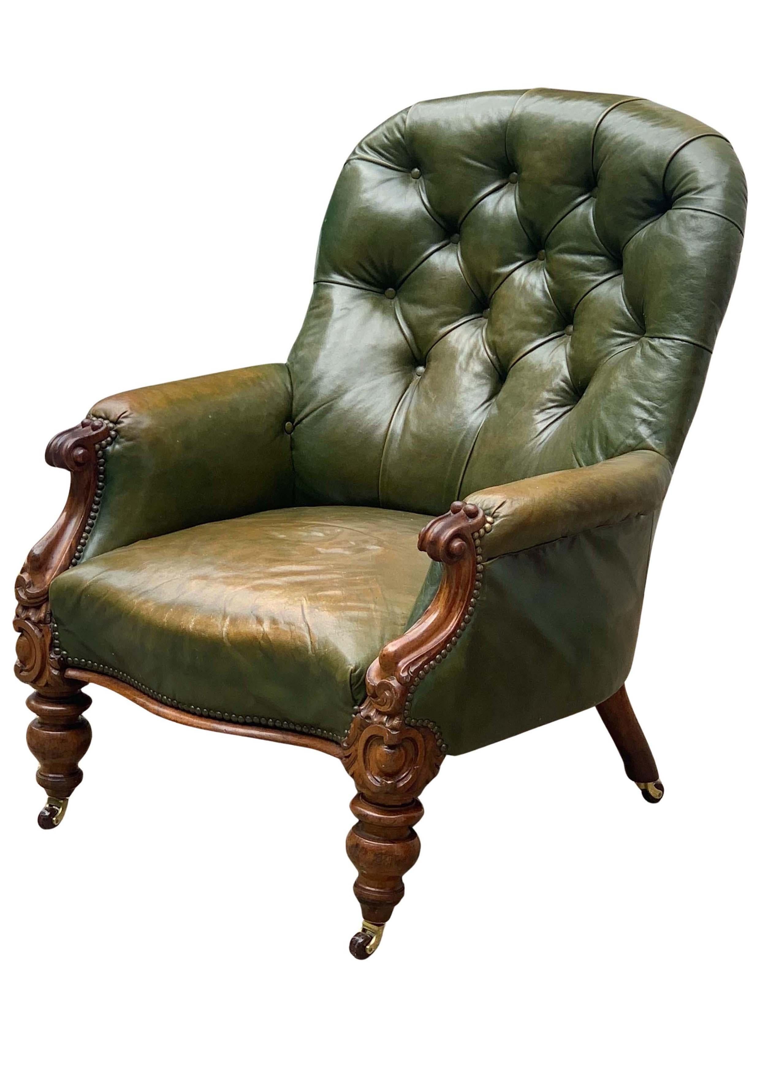 Antique English Victorian Polished Racing Green Leather Chesterfield Armchair With Brass Stud Detailing On Brown Porcelain Castors

Classic Button Back Library Chair With Carved Frame

Dimensions: Height: 92cm I Width: 78cm I Depth: 70cm
Height to