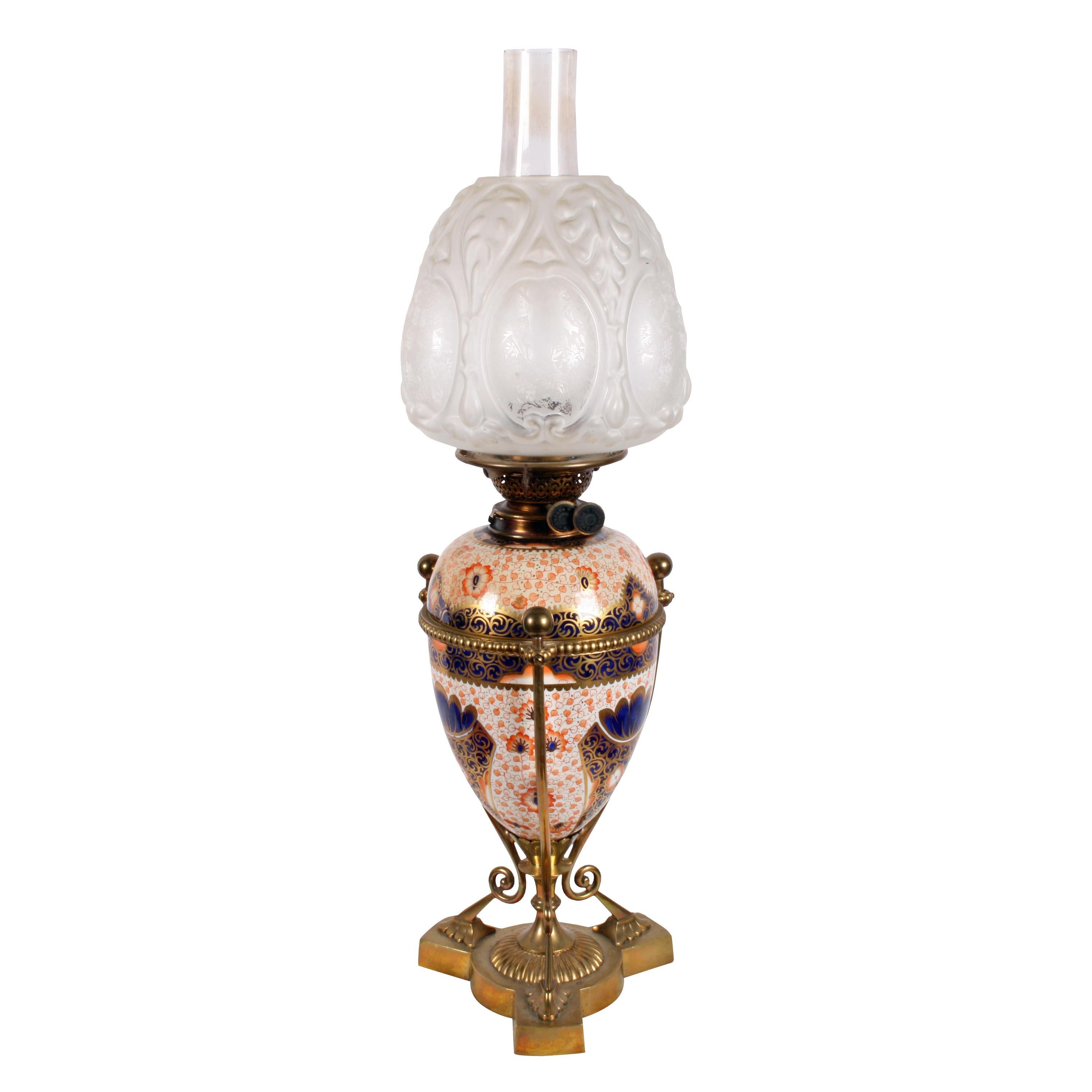 Victorian pottery oil lamp.


A fine example of a Victorian Staffordshire pottery oil lamp.

The lamp is held in a brass frame, the pottery is decorated with dark blue and red pattern on a white background and highlighted in gilt.

The top