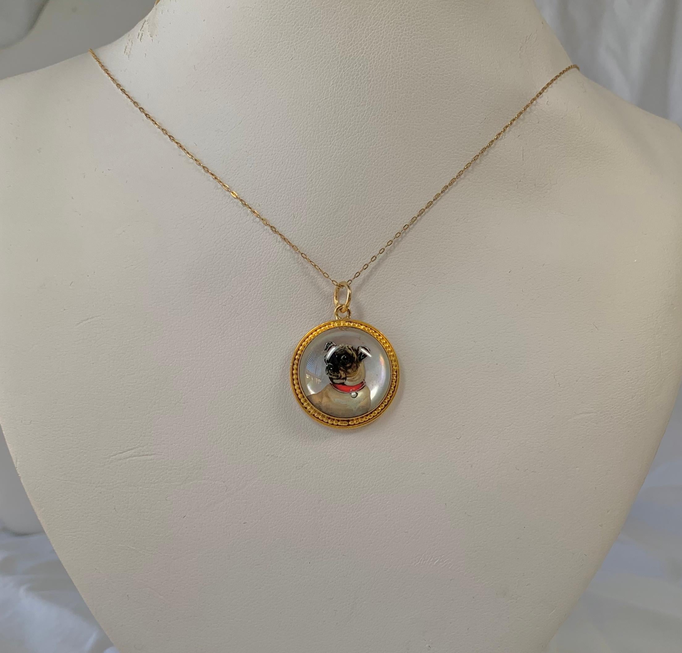 This is a gorgeous and very rare antique Victorian Essex Crystal, also referred to as a reverse crystal intaglio, Pendant with an exquisitely rendered carved and enamel image of a Pug Dog in 18 Karat Gold.  The Essex Crystal pendant is in superb