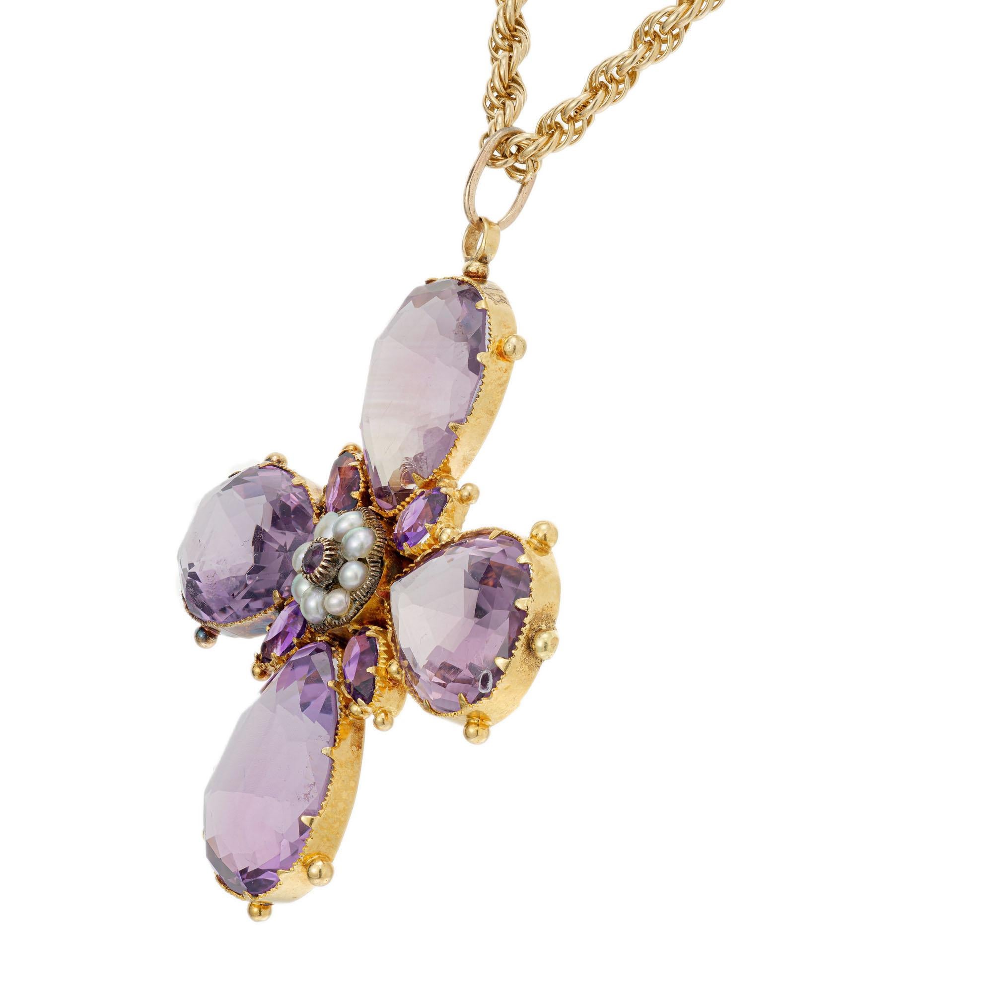 Amethyst and pearl Victorian 1890's cross shape pendant necklace. Natural amethyst and natural pearls in handmade 18k yellow gold with natural patina setting with 32 inch chain.  The back has a 7.5mm round center section with a crystal cover to