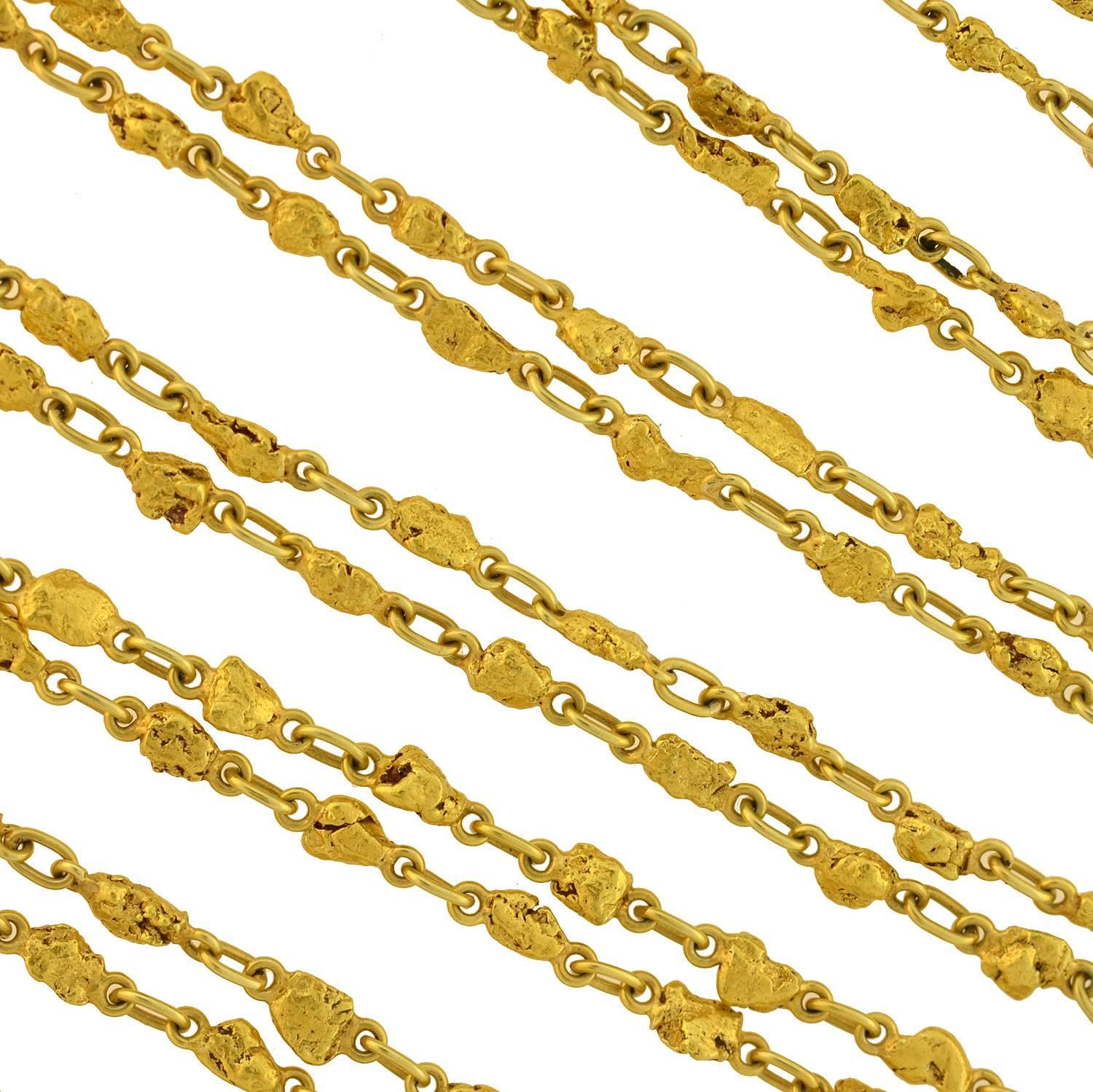 An incredible and unusual Victorian (ca1880s) era long gold nugget chain necklace! Crafted of genuine 22kt yellow gold nuggets connected by elongated links, this would have most likely have been a collectable souvenir from the California or Alaska