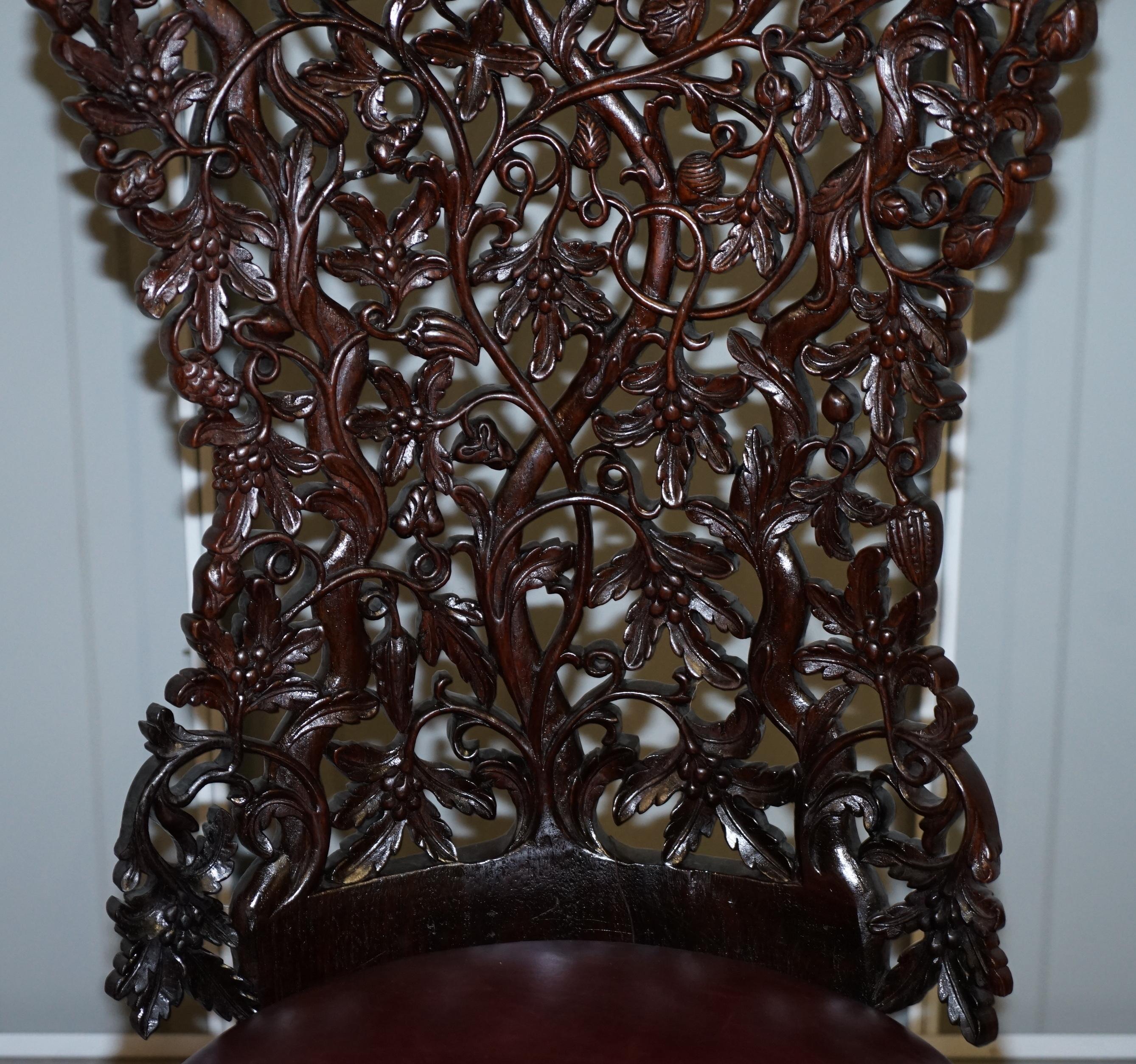 Anglo-Indian Victorian Rare Wood Hand Carved Anglo Indian Burmese Chairs Oxblood Leather Pair
