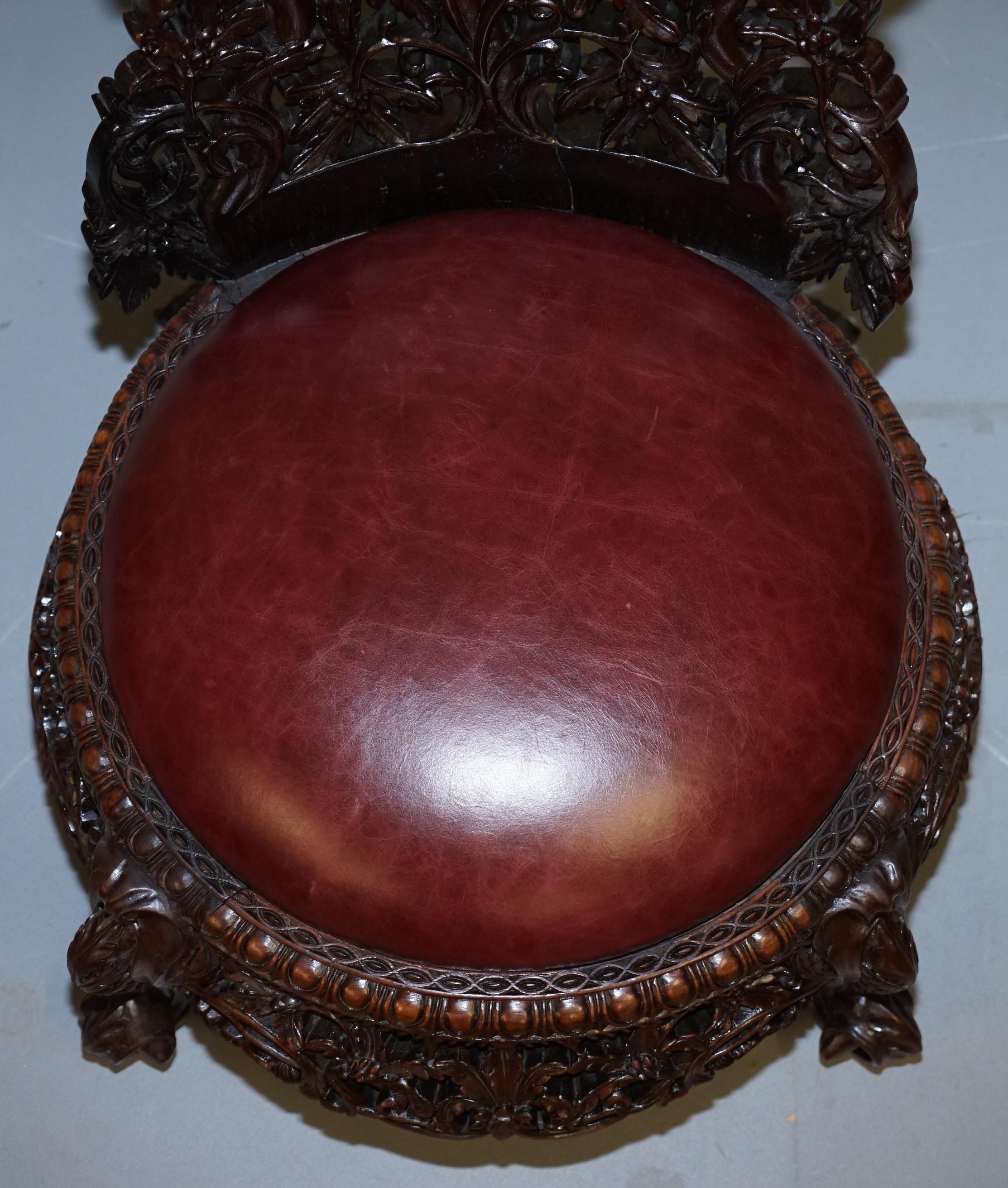 Hand-Crafted Victorian Rare Wood Hand Carved Anglo Indian Burmese Chairs Oxblood Leather Pair