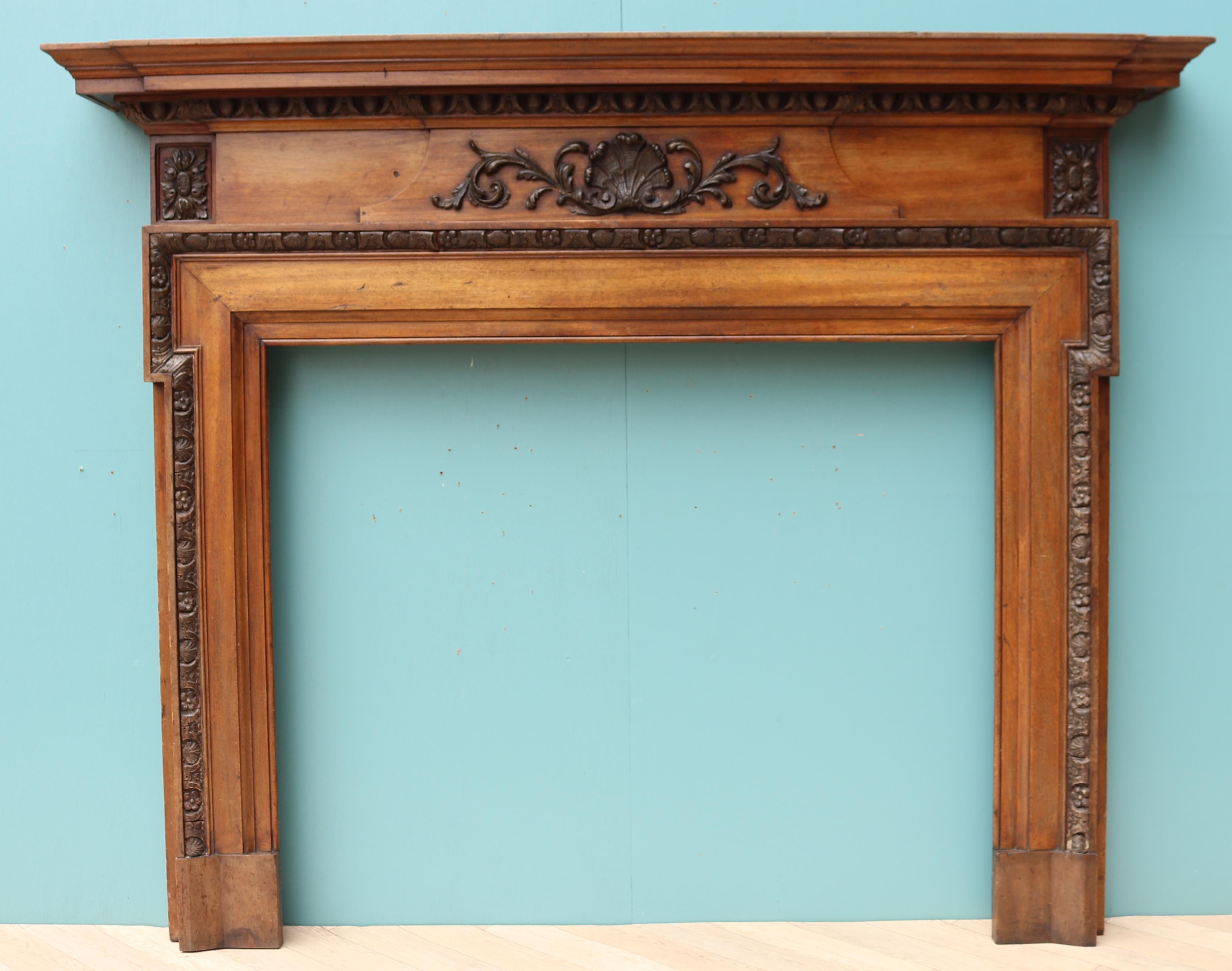An antique fire surround constructed from mahogany with gesso (composition) moldings.
 
Additional Dimensions:
 
Opening height  93 cm
 
Opening Width  101.5
 
Width between outside of foot blocks 149 cm