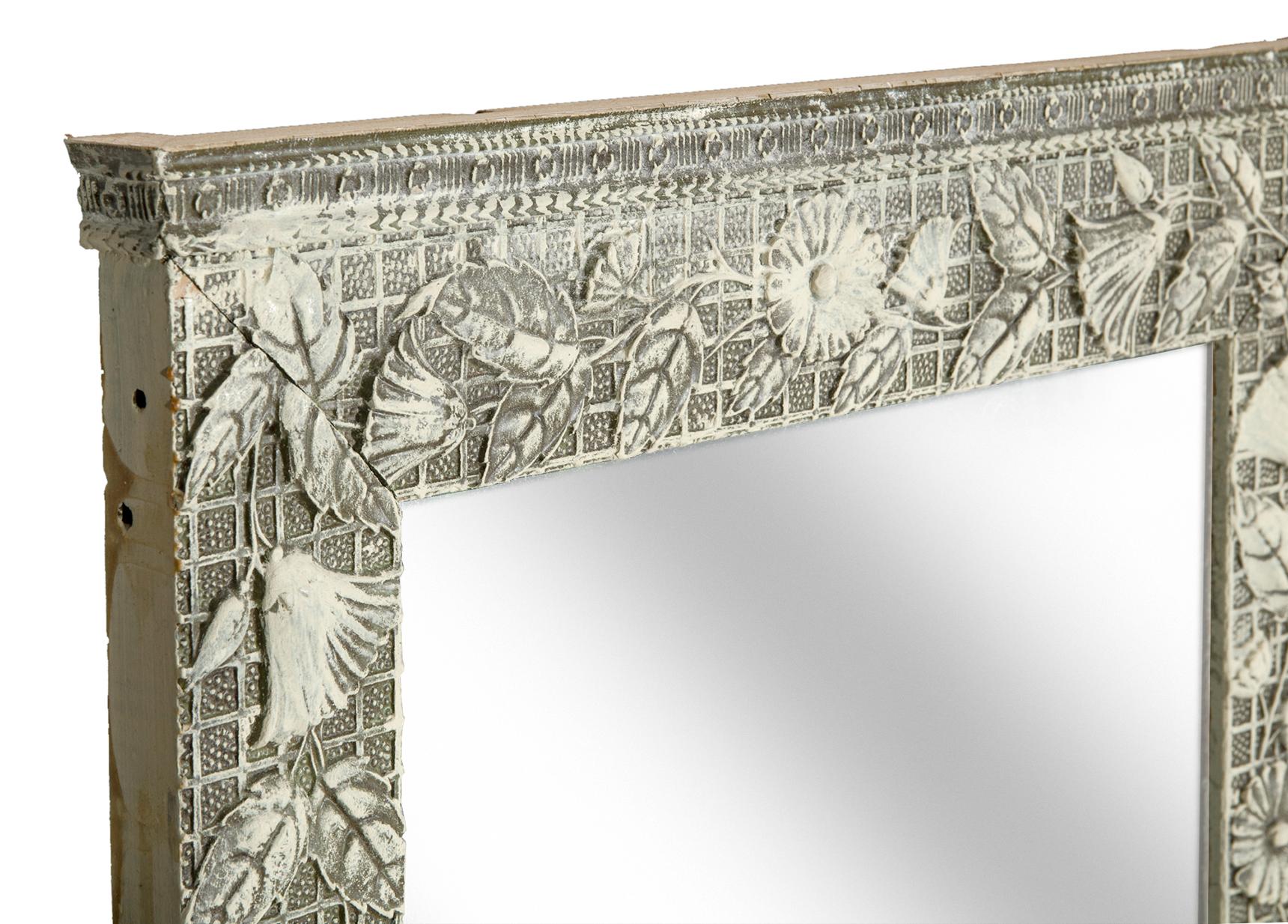 Pretty little framed mirror with new backing & wire. Aesthetic movement frame with a geometric background with overlaid pattern of flower blossom and leaves hand painted in 2 tone finish.