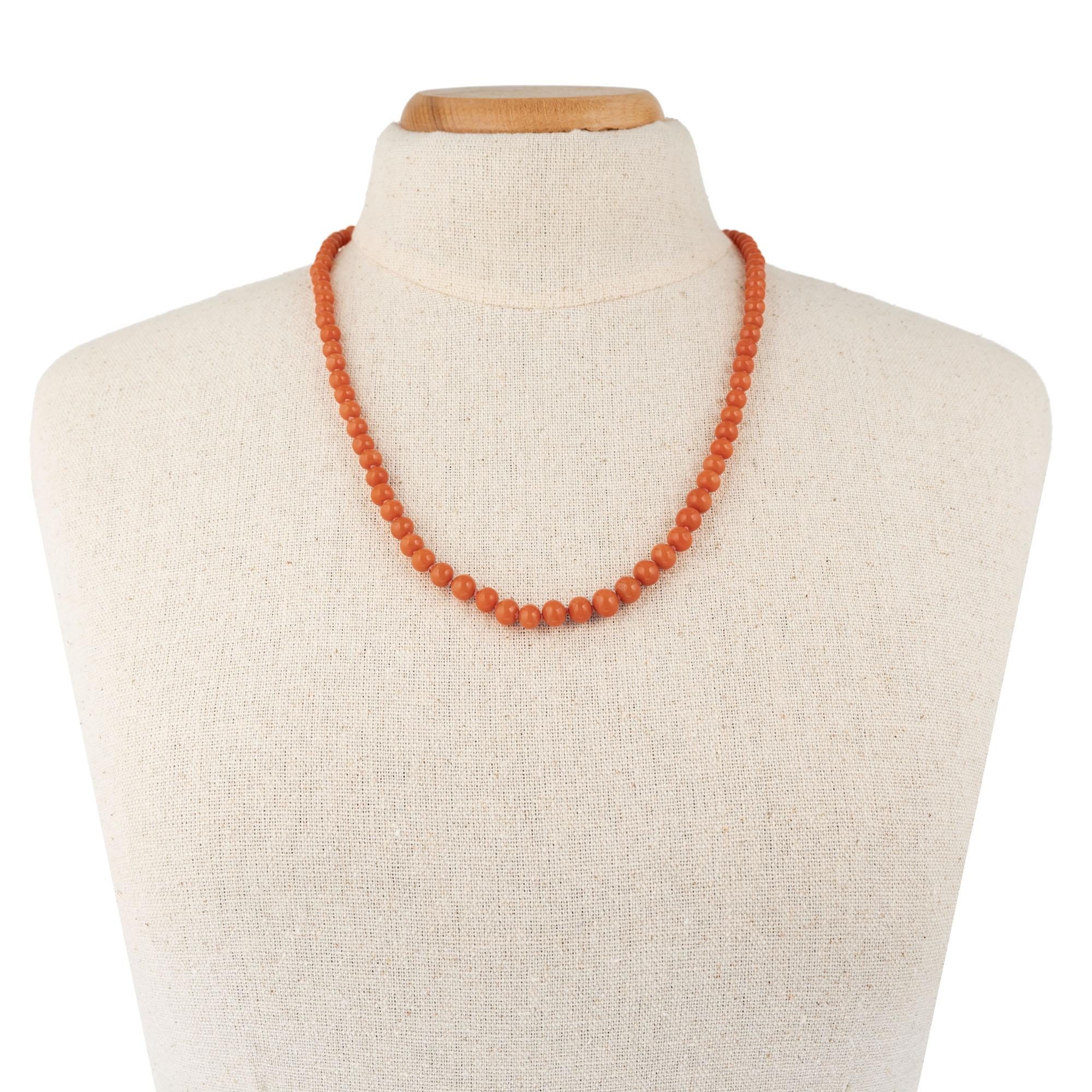 Victorian circa 1900. Well-polished native shape round Victorian natural untreated reddish orange Coral necklace. Freshly strung. Original 14k rose gold catch.

91 well-polished slightly irregular natural Coral beads 7.5 to 5.3mm. GIA certified