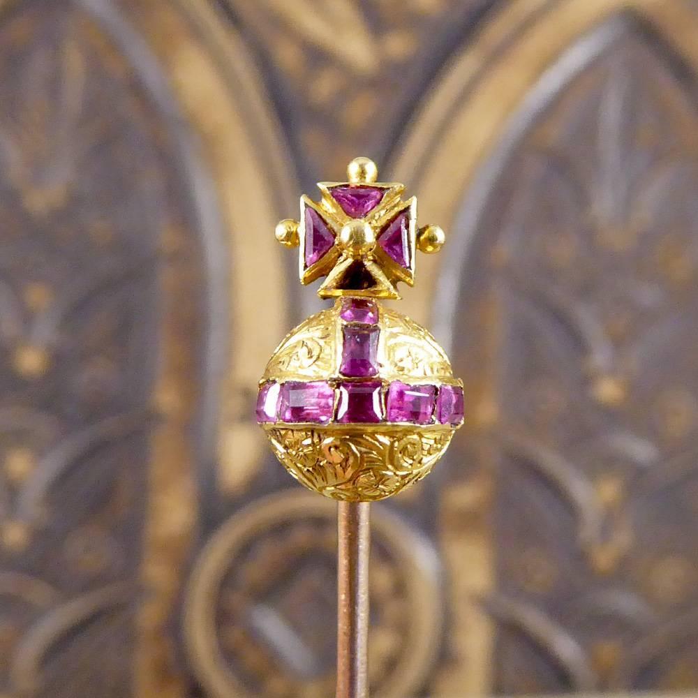 This gorgeous little stick pin holds a Maltese Cross sitting upon an Orb adorned with Garnets. One small defect with this piece is a single garnet stone missing at the bottom of the maltese cross. Sometimes a dainty stick pin is the perfect little