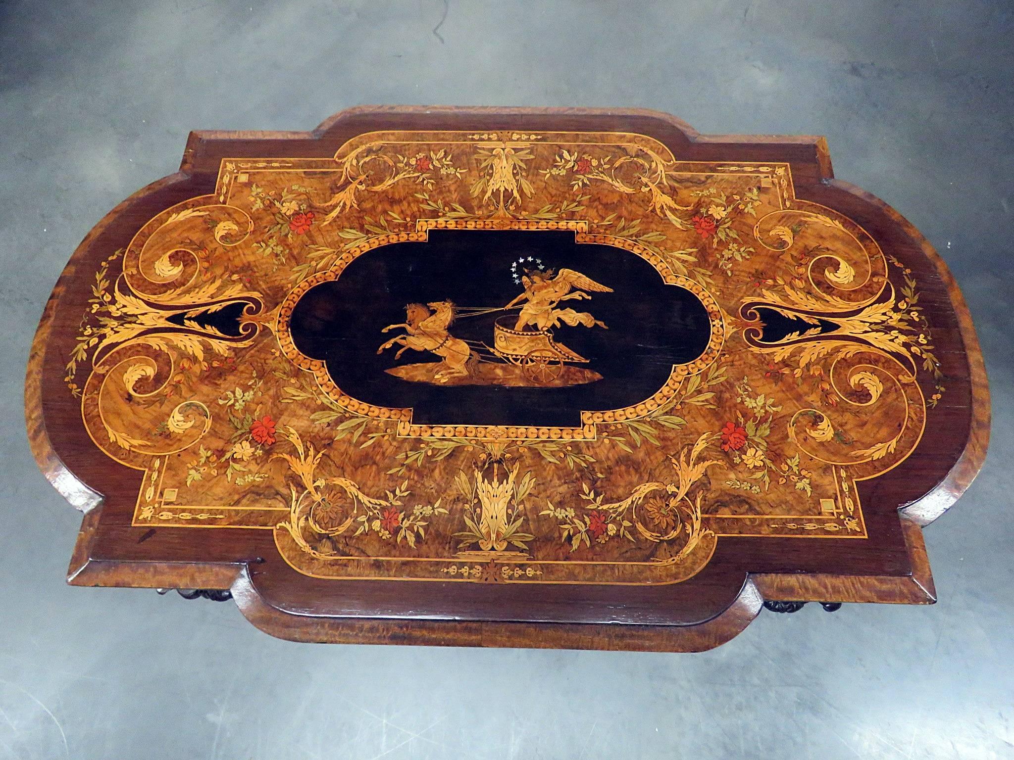 Victorian Renaissance Herter style library table. Inlaid with glass top.