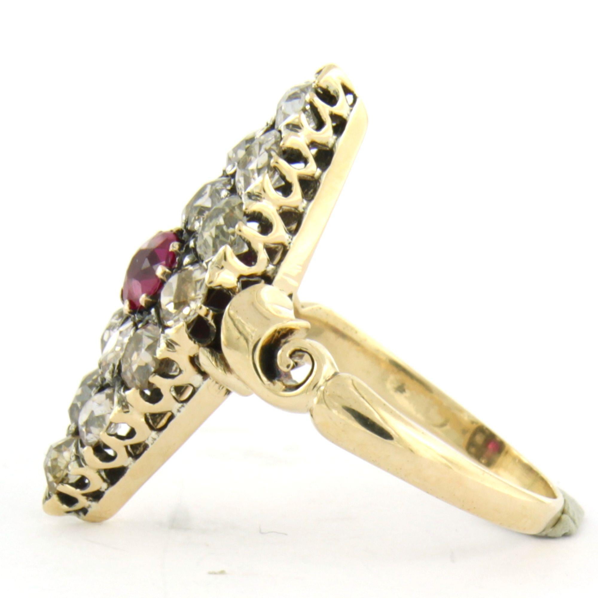 14k yellow gold ring set with a central ruby ​​up to 0.65 ct, surrounded by an old mine-cut diamond up to 1.20 ct – K/L - pique – ring size US 6.5 – EU 17(53)

Detailed description:

The top of the ring is marquise-shaped, measuring 2.5 cm by 1.0 cm