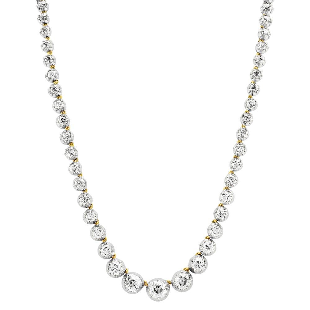 Victorian Riviere, Single Strand Old European Cut Diamond Necklace
Composed of fifty-eight graduated old european cut diamonds, the three central diamonds weighing 1.61, 1.41 and 1.22 carats. Approximate total diamond weight 22.0 carats. Assessed