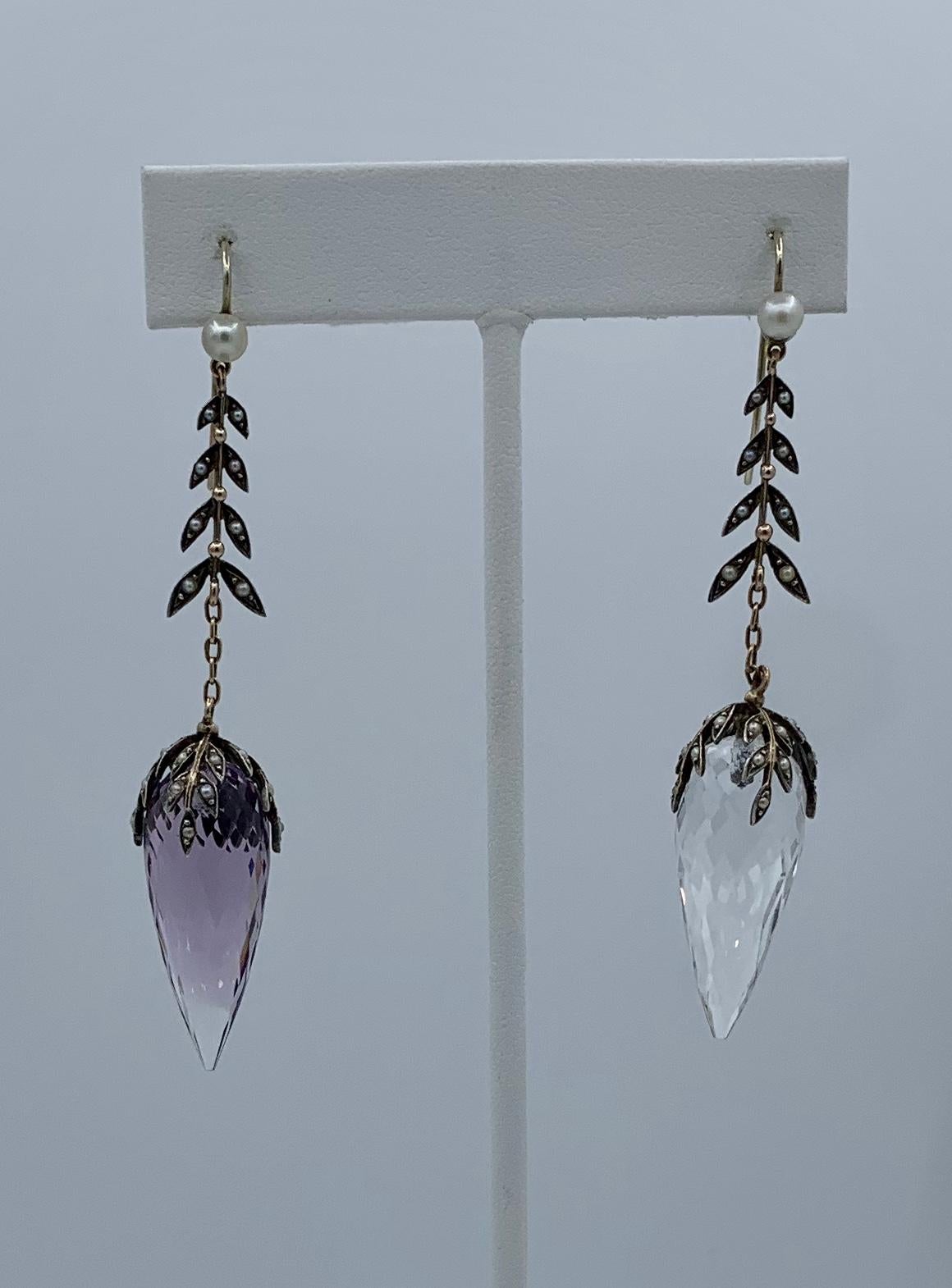 These Antique Victorian - Belle Epoque Dangle Drop Earrings are spectacular with exquisite pointed briolette Rock Crystal drops of clear and rose colored Rock Crystal hanging from a line of seed pearl leaves and of a dramatic 3 inches long.  The