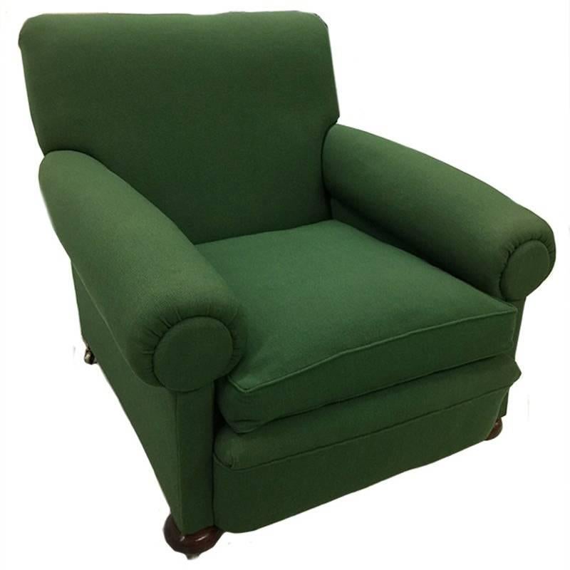 An English 19th Century green deep seated club roll arm chair