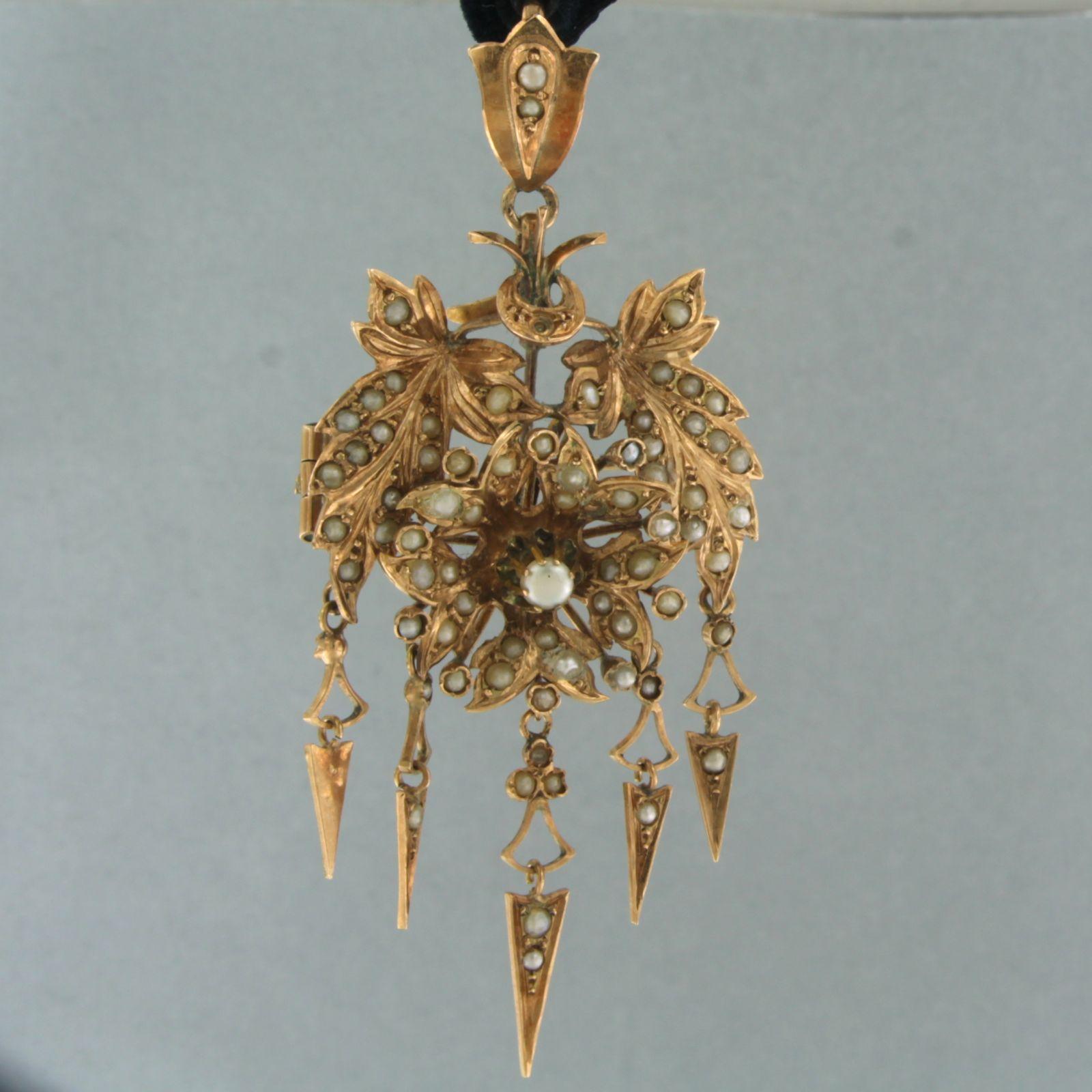 14k rose gold pendant set with pearls, with black ribbon

detailed description:

the pendant is 6.5 cm long by 3.0 cm wide

Black ribbon is approximately 50 cm long, end can be tied yourself

Back of pendant is provided with pin

weight 8.2