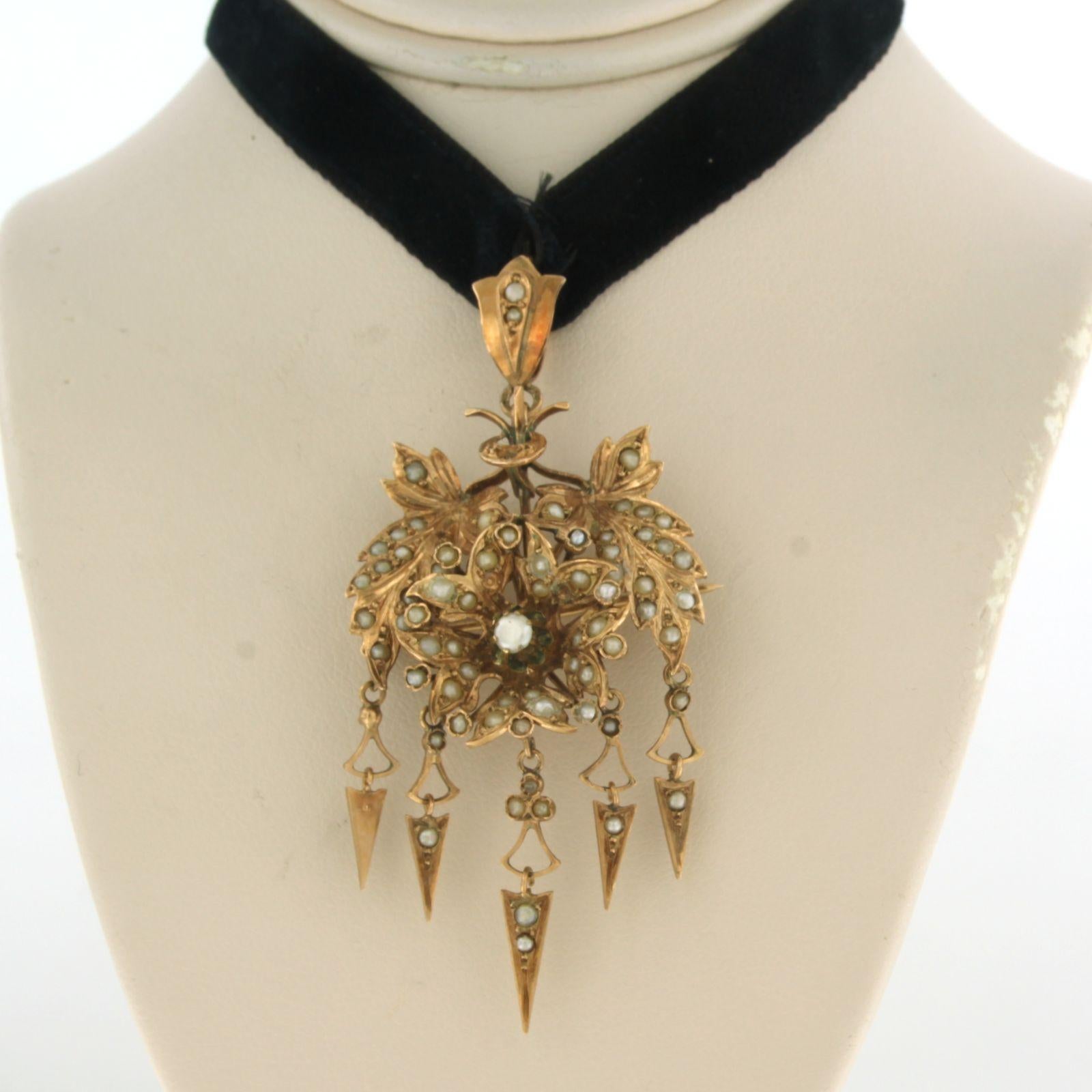 14k pink gold pendant set with pearls, with black ribbon

detailed description:

the pendant is 6.5 cm long by 3.0 cm wide

Black ribbon is approximately 50 cm long, end can be tied yourself

Back of pendant is provided with pin

weight 8.2