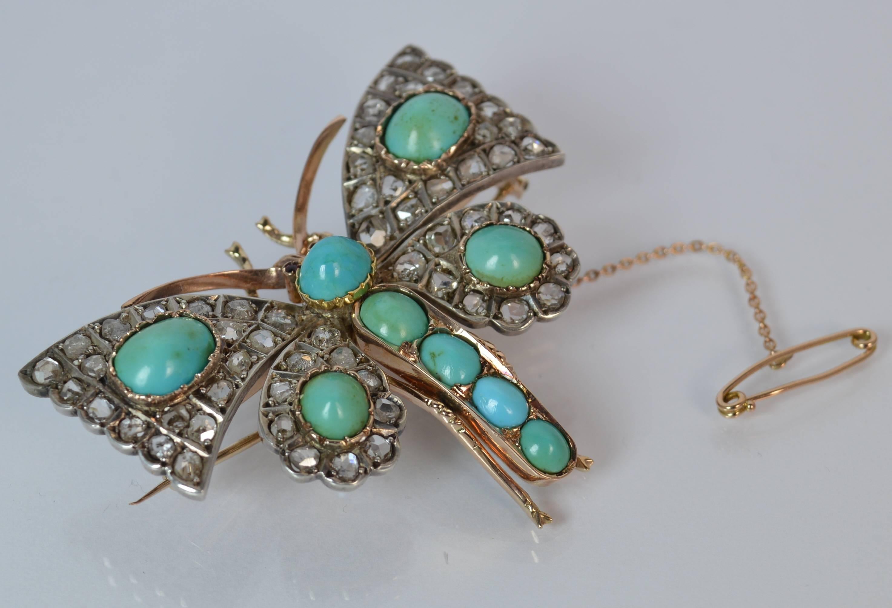 A beautiful example of a Victorian period brooch.

​Modelled as a realistically formed butterfly in 15 carat gold.

​Designed with two small round cut rubies as eyes with large oval turquoise cabochons to the body and wings with 58 natural rose cut