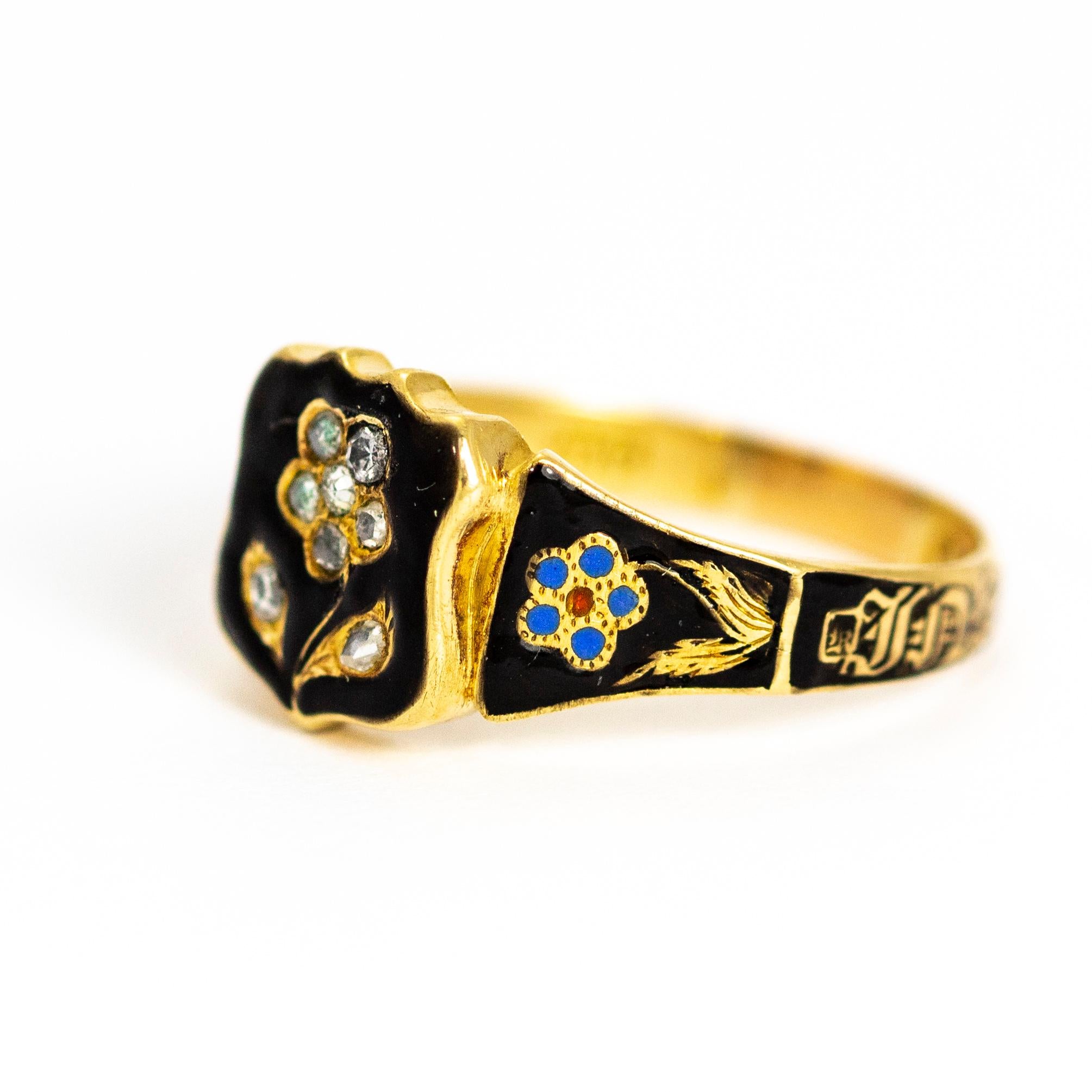 This forget me not mourning ring has so much lovely detail and even has a locket back. The shield shaped panel at the heart of the ring holds the forget me not which is adorned with rose cut diamonds and the shoulders feature two more flowers