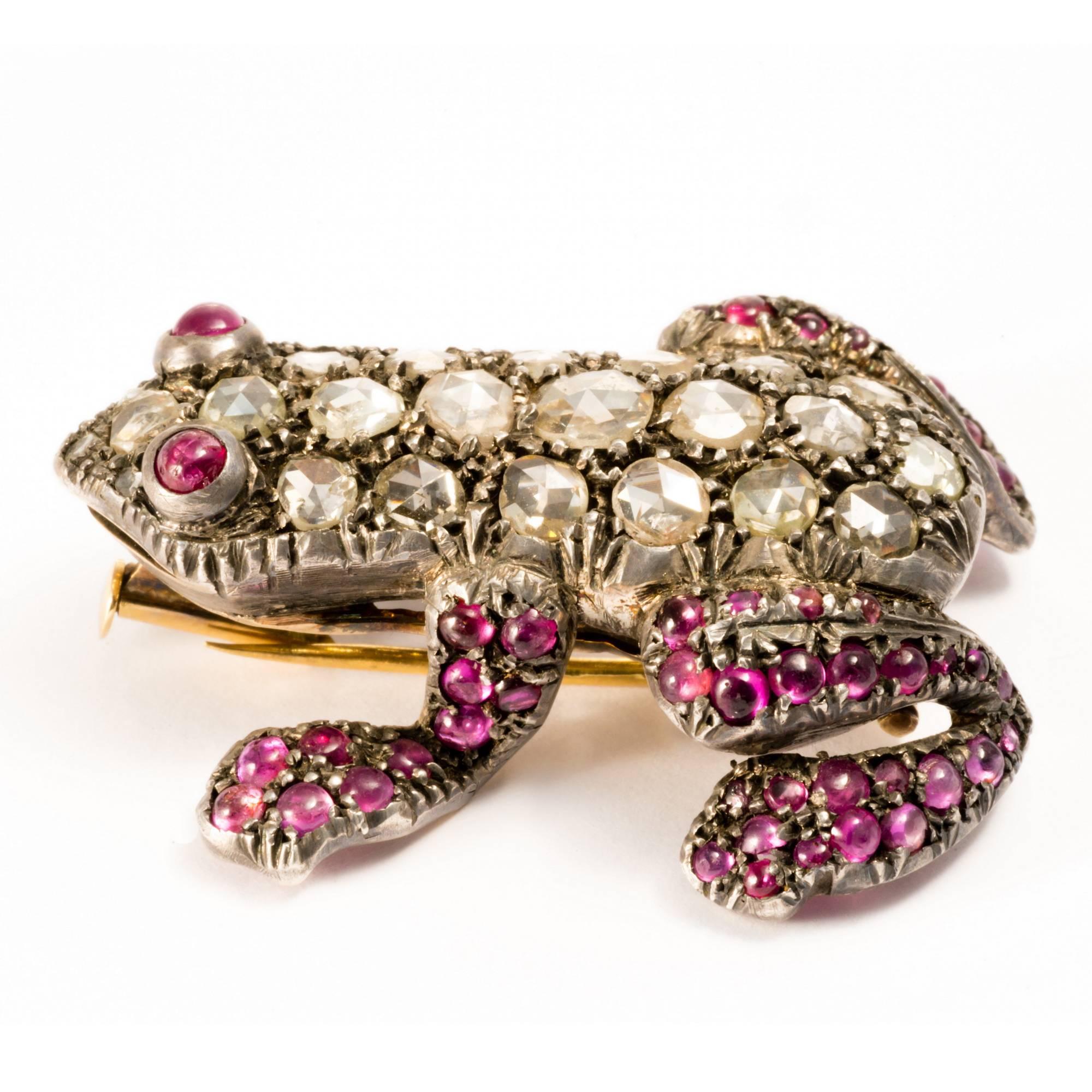 This unique  pin features a beautifully crafted frog,  symbol of the power of transformation and  fertility.  19 rose-cut diamonds and 73 cabochon cut rubies are exquisitely set to form body,  legs and eyes of the amphibian.
The brooch can be easily